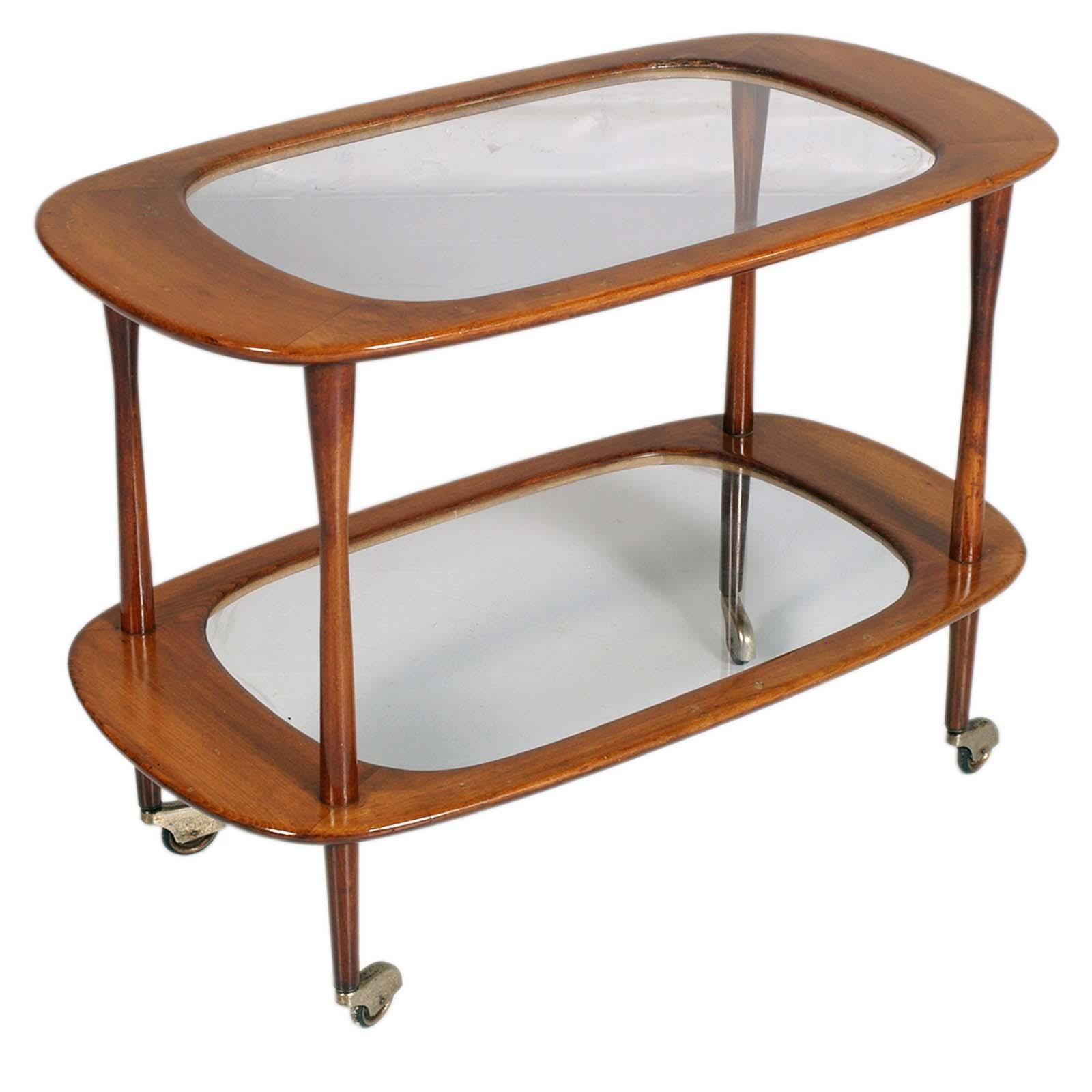 Iconic Mid Century Service Cart by Cesare Lacca for Cassina, in Teack , with original Crystal Tops
This fantastic piece was designed in Italy during the 1950s for Cassina.

This piece is going to add lightness to a living room with its shapes and