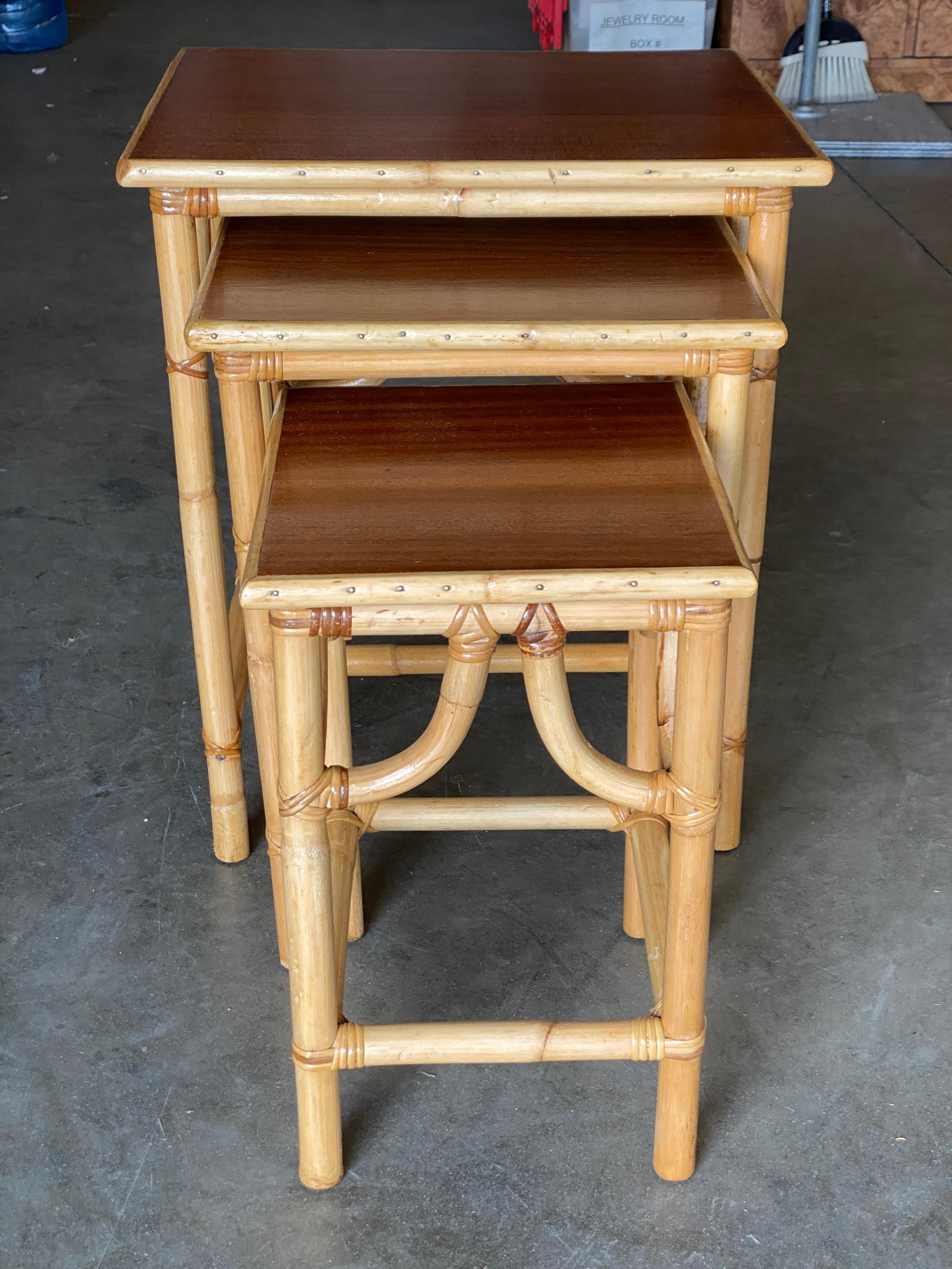 Mid-20th Century Restored Mid-Century Set of 3 Rattan Nesting Side Tables with Mahogany Top For Sale