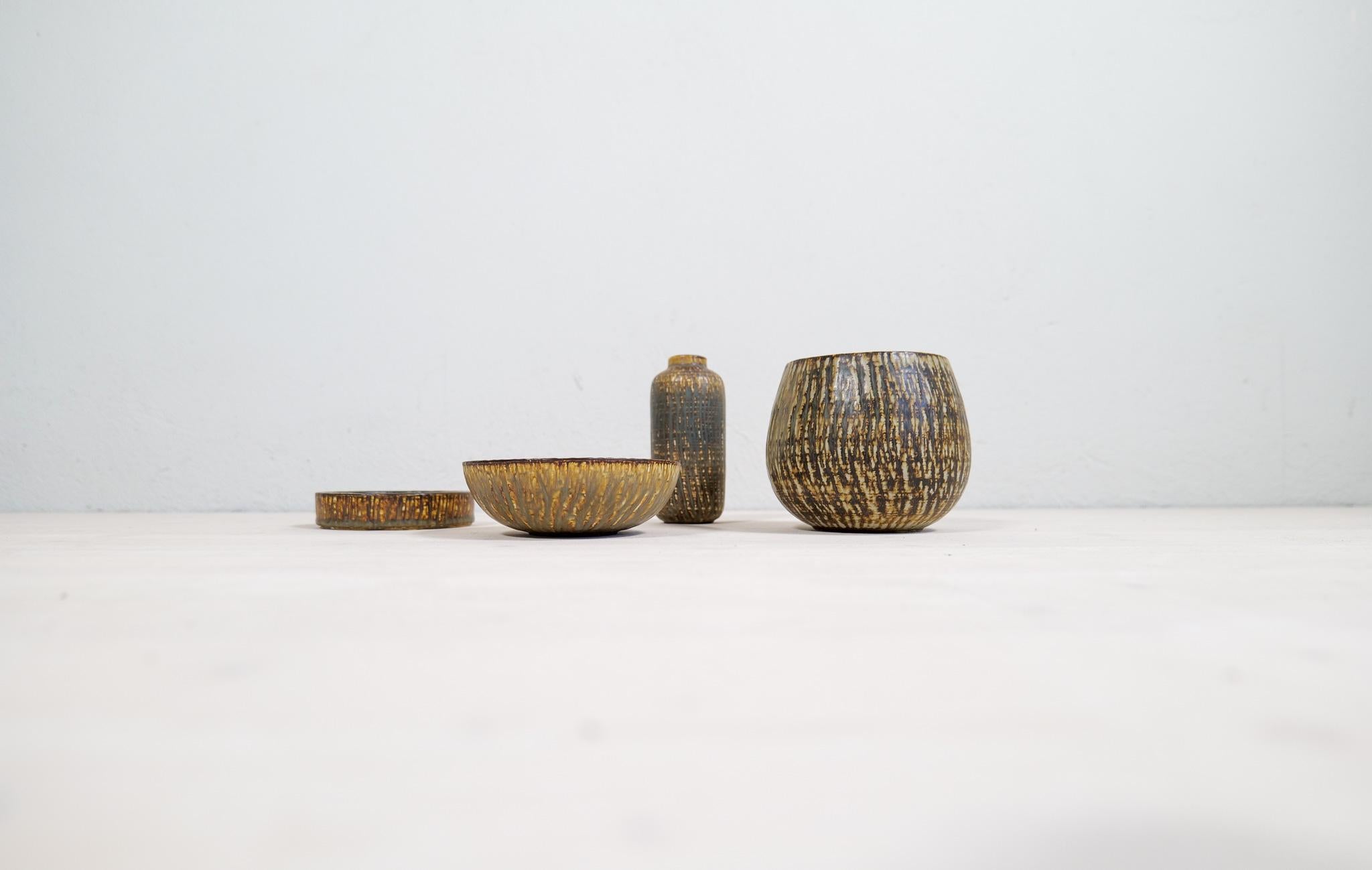 These vessels and vases made in ceramic and named Rubus was designed by one of the ceramic designer icons of Sweden Gunnar Nylund. This set containing g 4 pieces with wonderful earthy colors and shape. 

Good vintage condition, with wear.