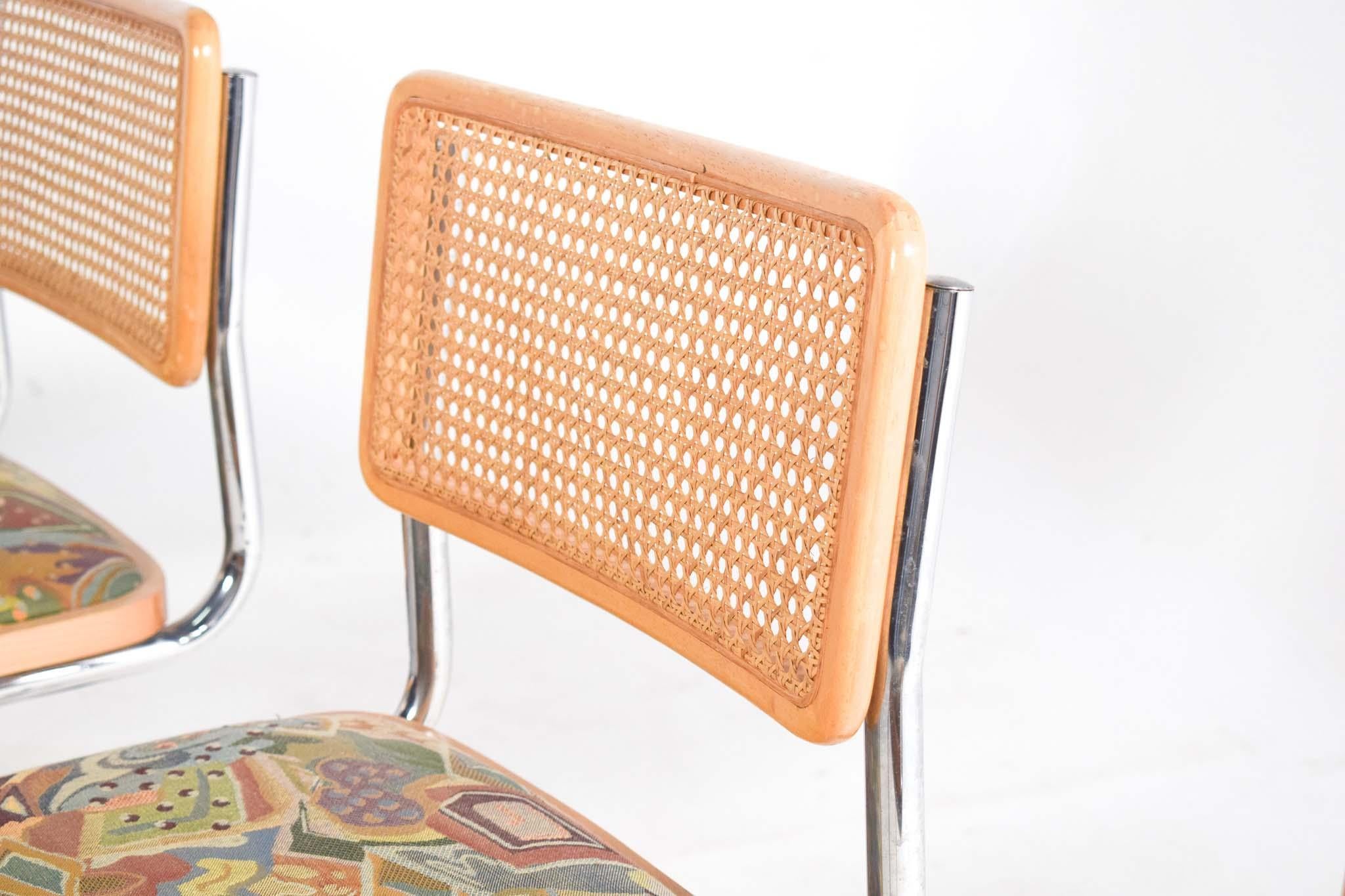 Dining Cesca chairs designed by Marcel Breuer in 1928 and produced since that year till today. Chrome plated tubular frame, seat in fabric and back with rattan and frame in natural beech wood make the chair more flexibility and comfort. Cesca was