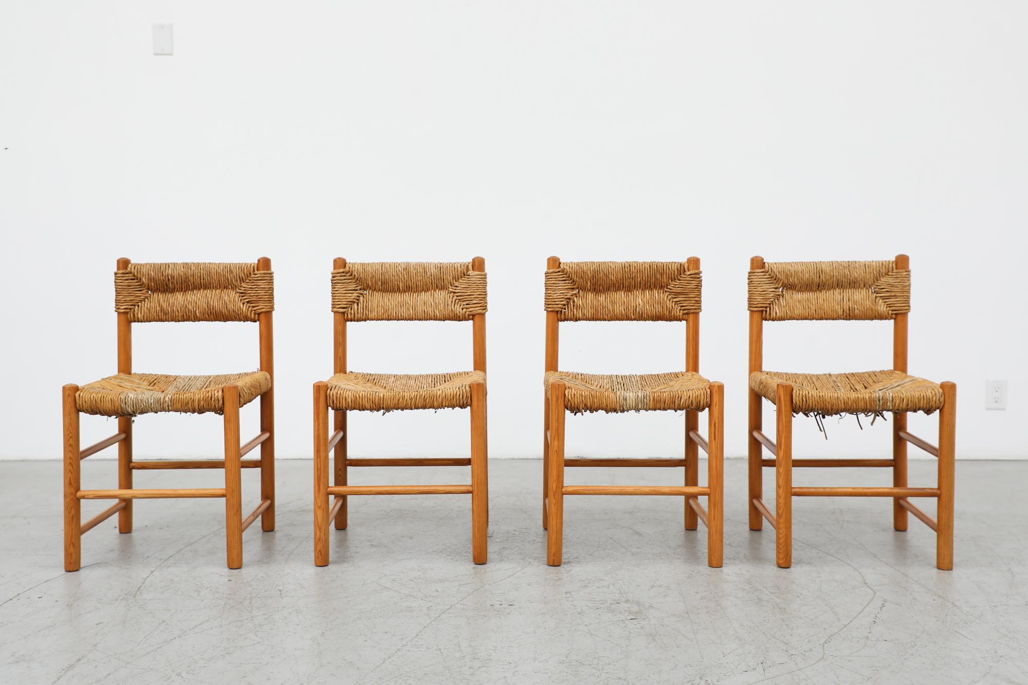 Set of 4 Charlotte Perriand style dining chairs with rush wrapped seats and backrest. Lightly refinished frames with some repairs to broken rush seating. The new rush is a bit green and will dry and change color to closely match the original over