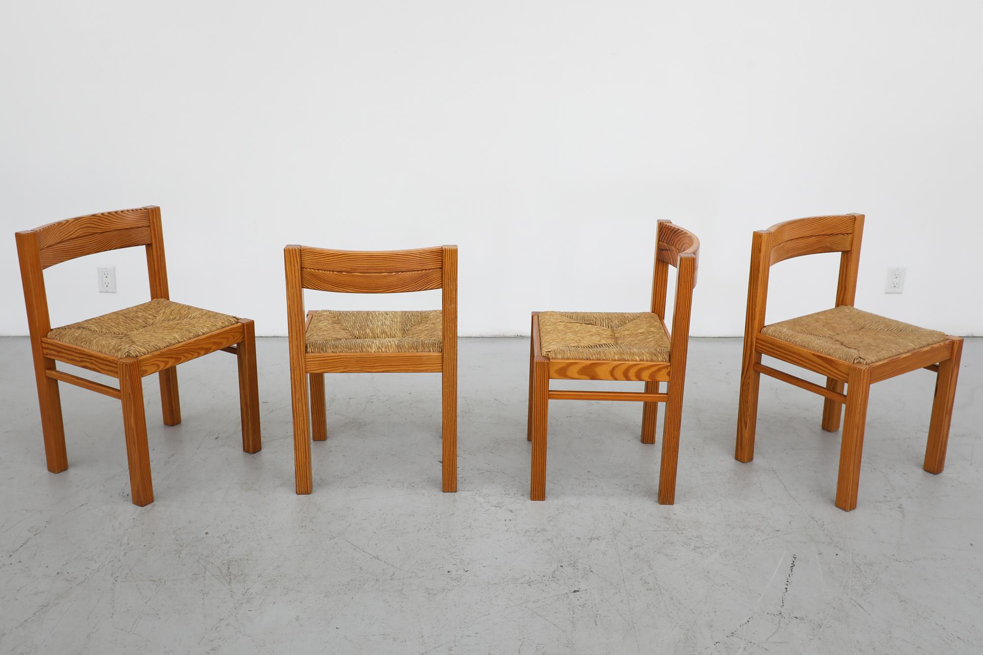 Set of 4 pine dining chairs by Dutch Mid Century icon Martin Visser for 't Spectrum with woven rush seats and a curved backrest. In original condition with visible wear to the wood frames and there may be some rush breakage. Wear is consistent with
