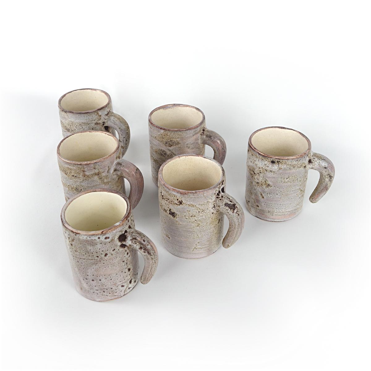 Very rare set of 6 ceramic mugs by Francis and Josette Bonaudi for Vallauris of France. Hand made and also glazed by hand, making each mug individual.