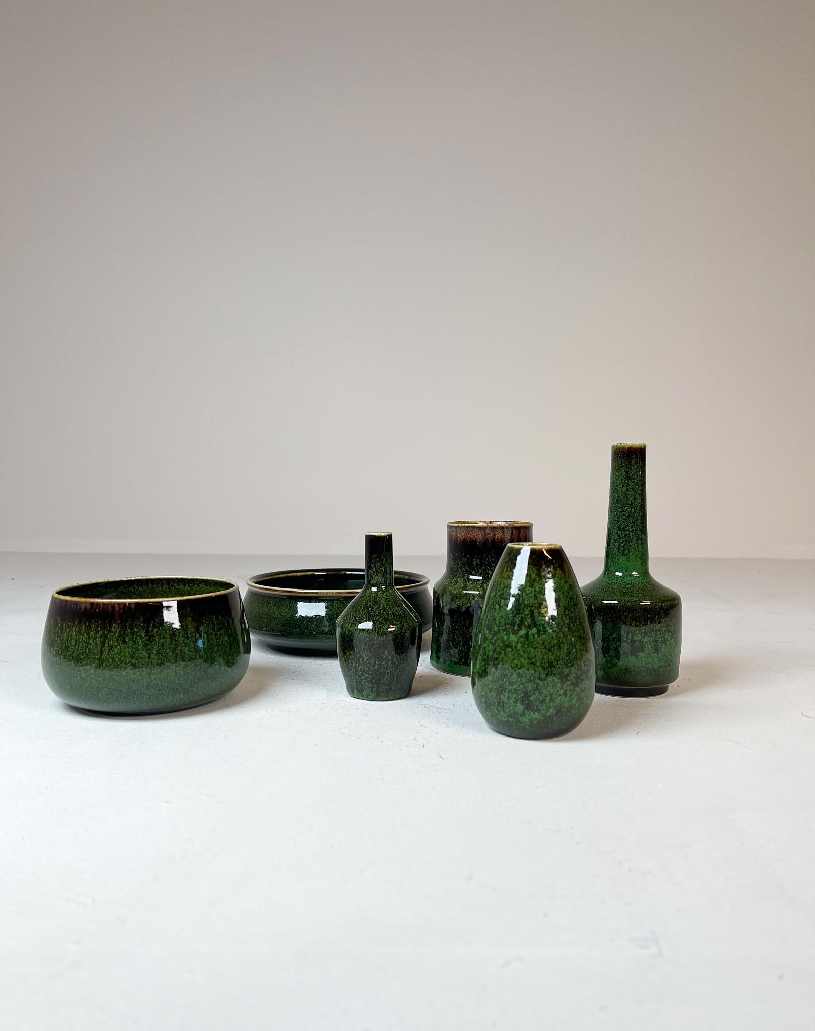 Collection of vases and bowls from Rörstrand and maker/Designer Stålhane. Made in Sweden in the mid-century. Beautiful, glazed vases in good condition. This set of green vases and bowls are nice edition to any modern home. 

Dimensions: Vase’s