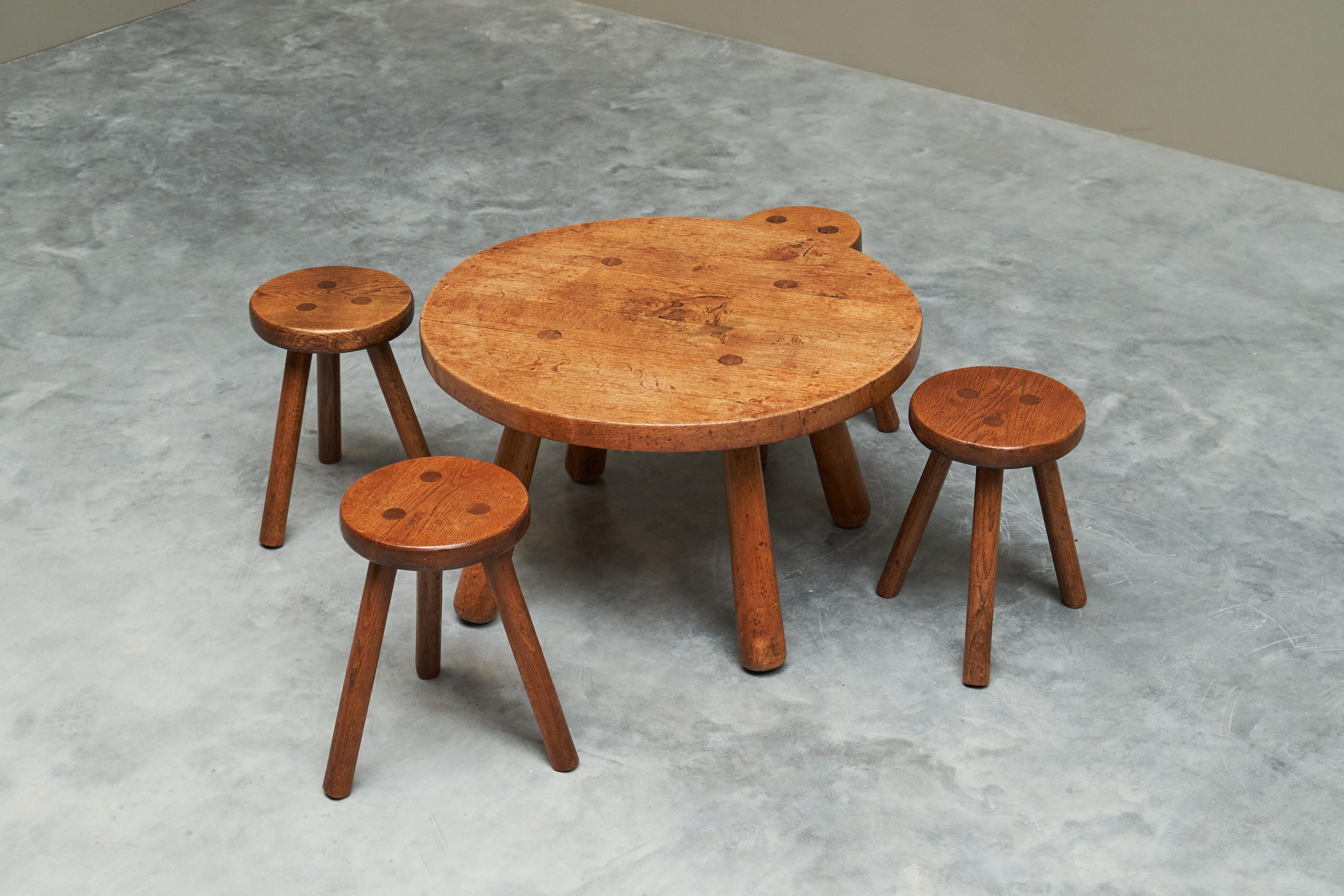 Mid Century Set of Coffee Table and Stools in Solid Oak 1950s

This is a wonderful set of a mid century coffee table and 4 stools in solid oak, made in Belgium in the middle of the 20th century. Comes directly from their first owner.

A playful yet