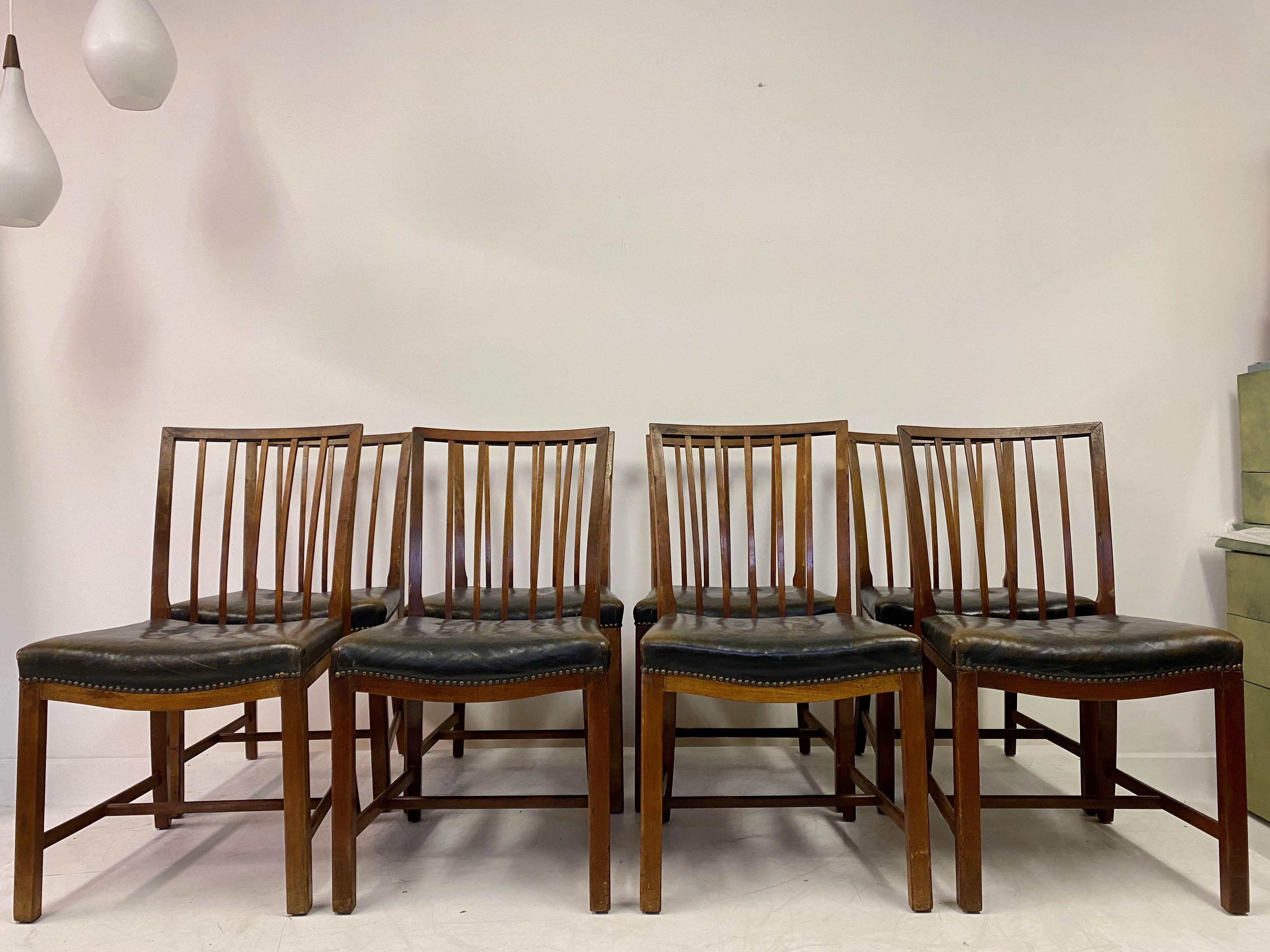 Set of eight dining chairs

By master cabinetmaker Frits Henningsen

Teak frame

Original leather

1935-1945

Denmark

Measures: Seat height 47cm.