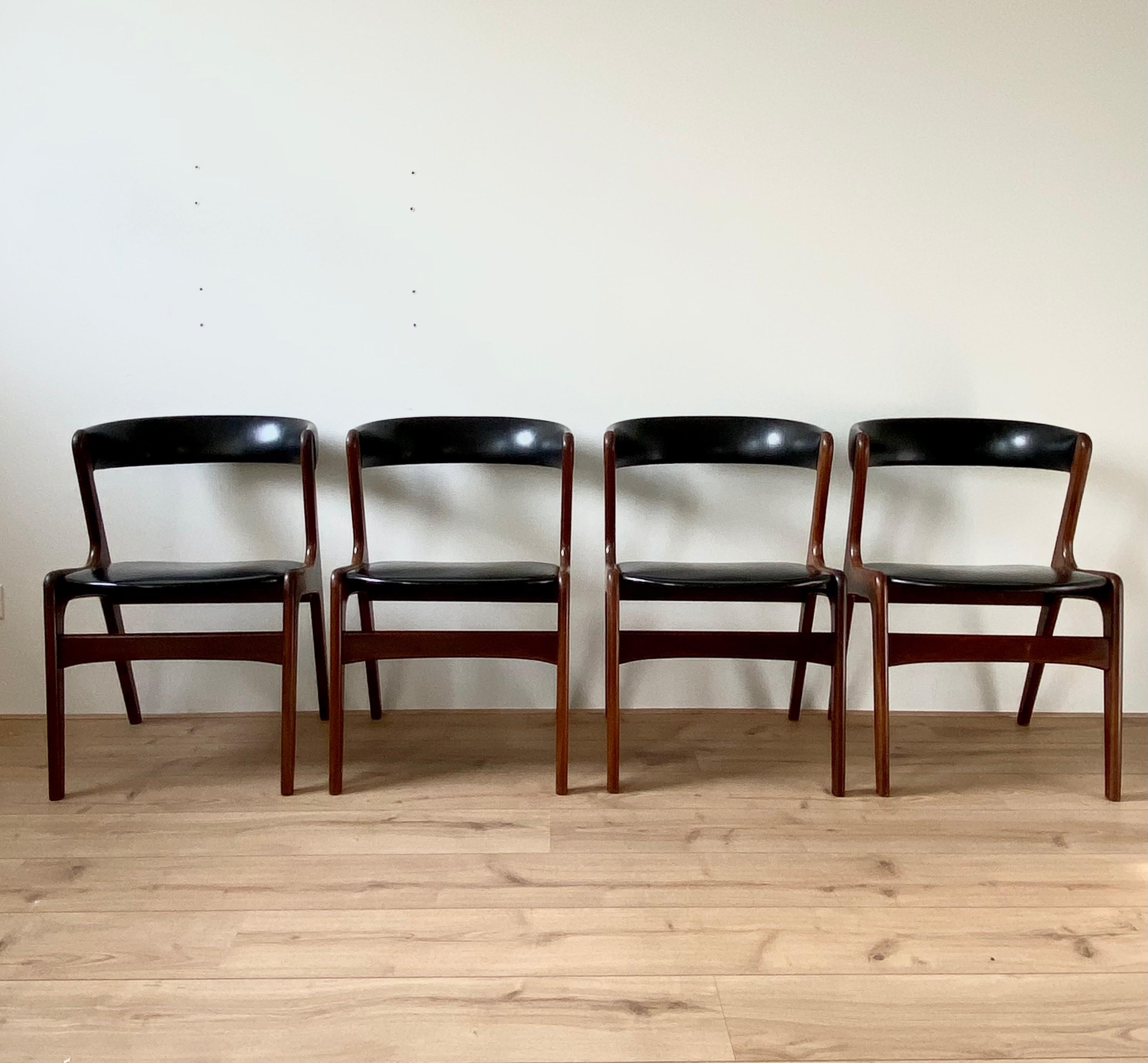 Very elegant Danish Design chairs by T.H. Harlev for Farstrup Mobler, ca. 1950s-1960s. The chairs feature a sculptural teak frame with black leatherette upholstery. and offer great comfort. They remain in good and original condition with some light