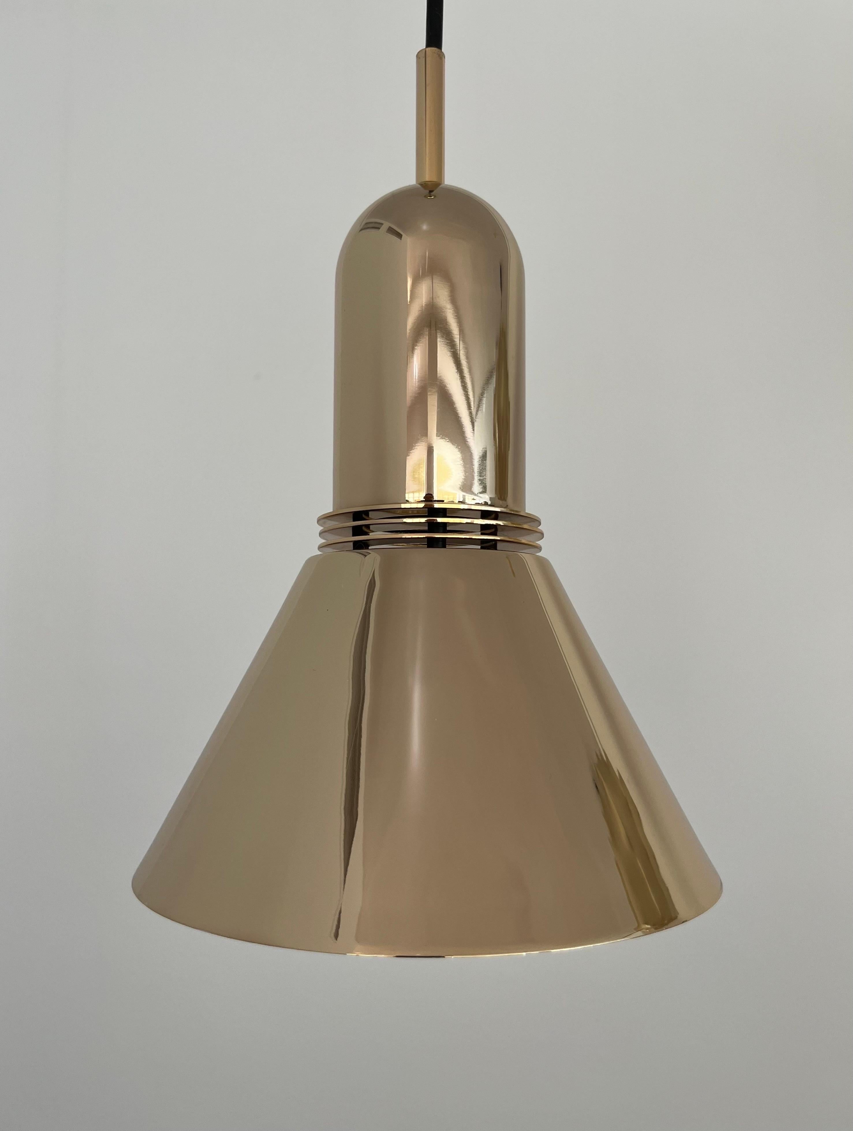 Beautiful and unique midcentury Set of Four of Gold Long Chandeliers by Leonardo Marelli for Estiluz. Model: T-1142 Dorado (golden). These fixtures were manufactured in Barcelona (Spain) during 1970s. Chrome plating in gold and Interior: white