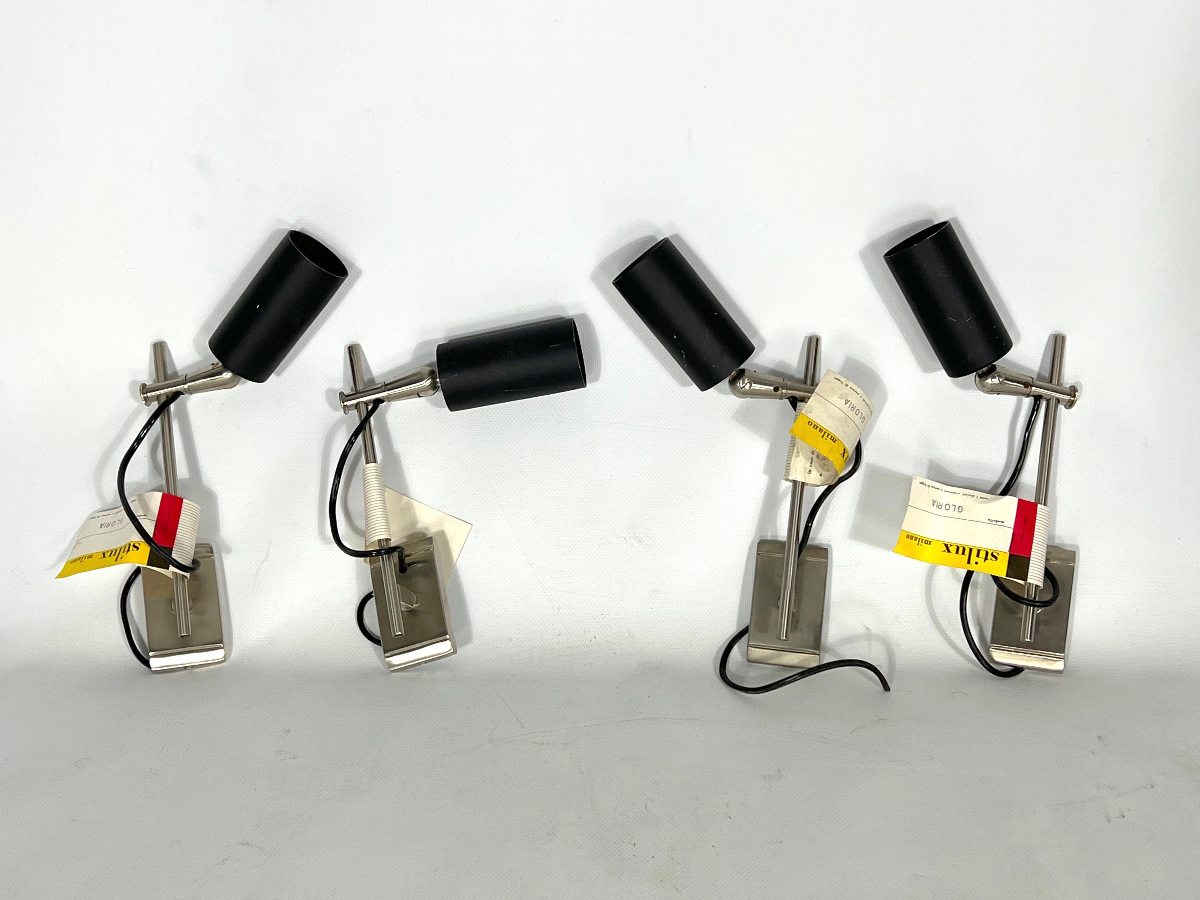 Great vintage condition with small trace of age and use for this set of four inedited and rare orientable spotlights produced in Italy during the 60s by Stilux Milano. Stock fund with original label and tag of manufacturing. Full working with EU