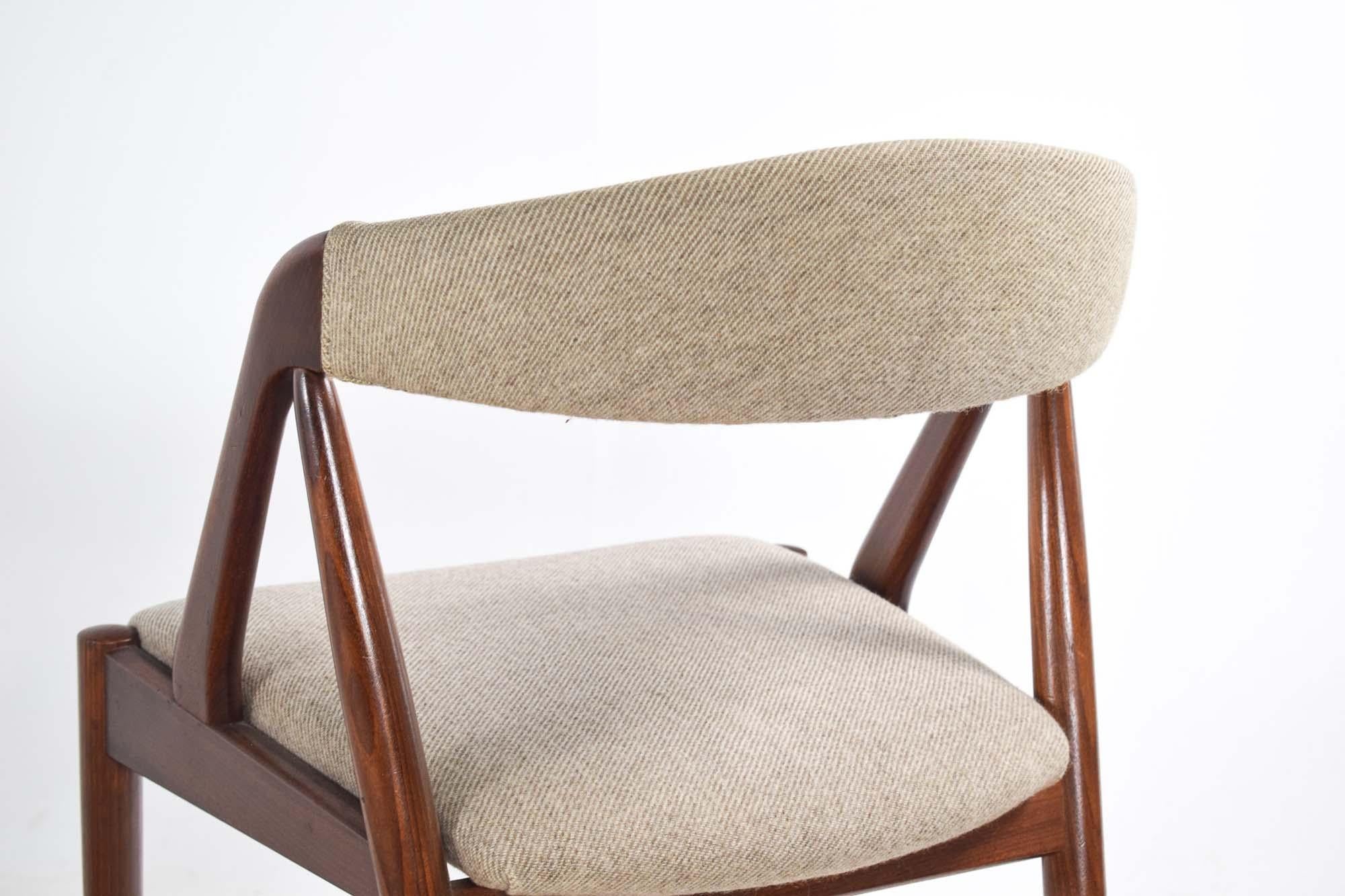 This set of four dining chairs by Kai Kristiansen, Model 31, epitomizes the timeless elegance and comfort of Danish mid-century design. Crafted in 1960, these chairs showcase the distinctive aesthetic and exceptional craftsmanship that define