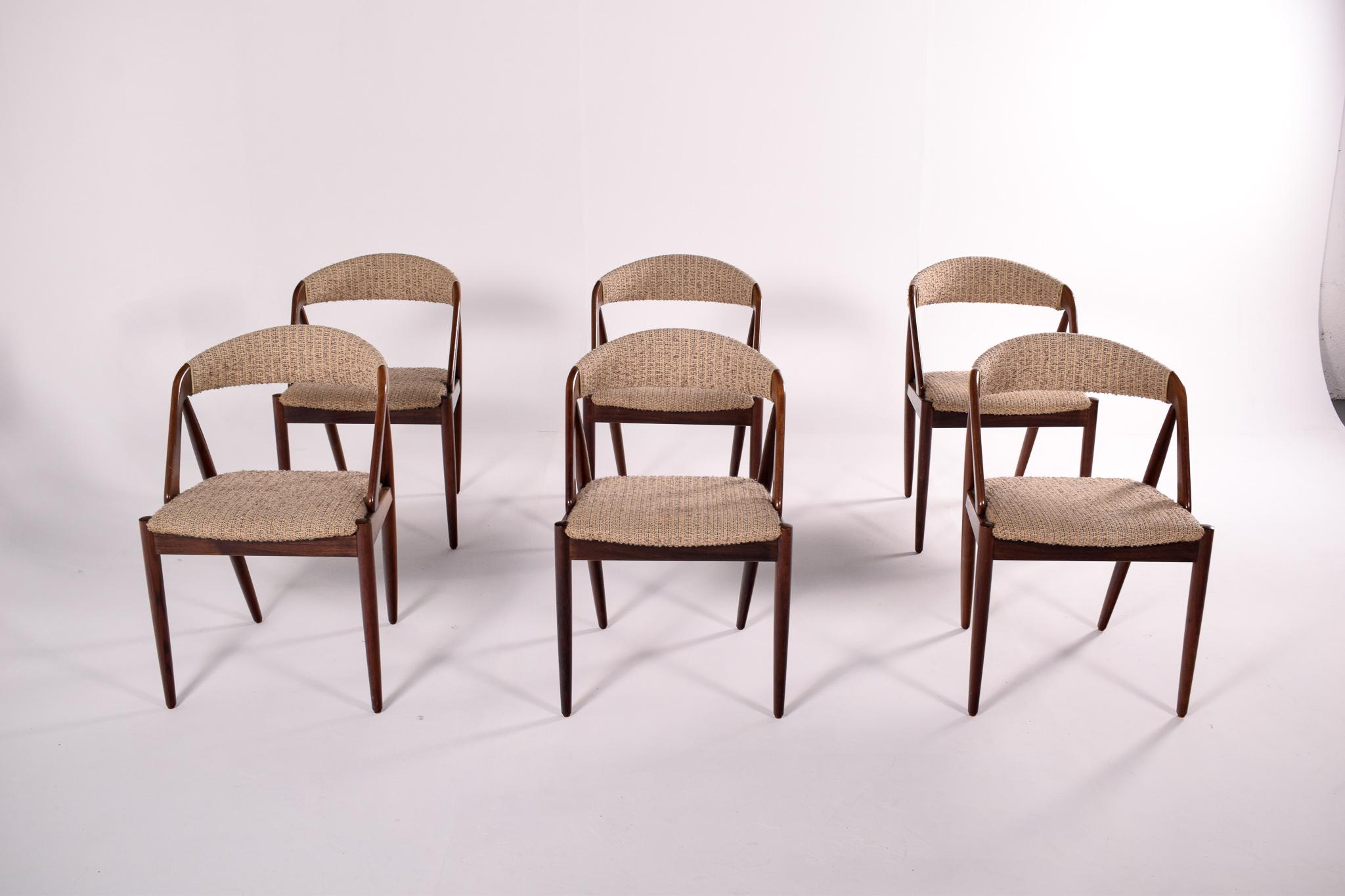 Mid century set of six rosewood and fabric dining chairs by Kai Kristiansen. Model 31. These Danish Mid-Century dining chairs were designed by Kai Kristiansen in 1960. Rosewood framed and original fabric upholstery. Set of 6 comfortable chairs with