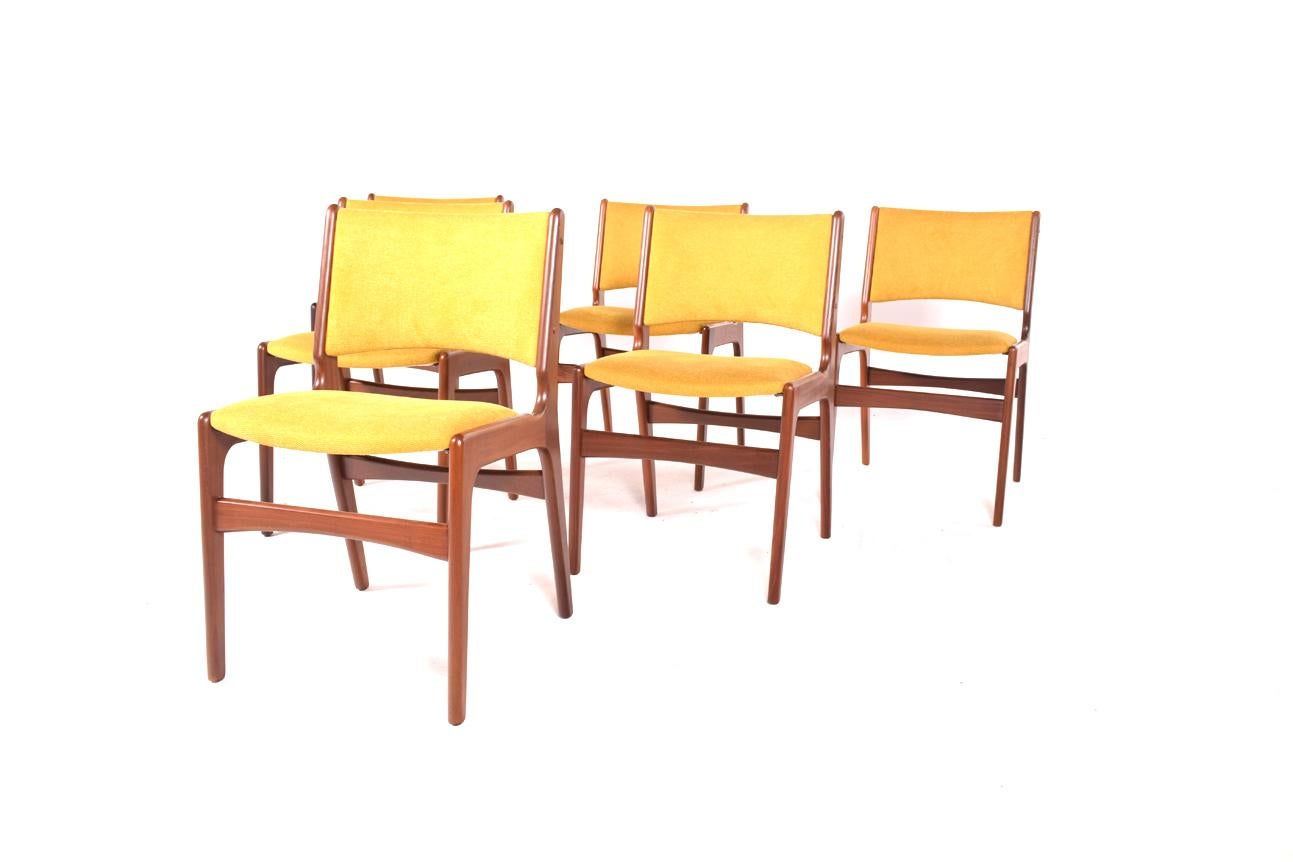A set of six gorgeous 1960s, dining chairs, high back. Solid teak wood frame. New upholstery in yellow fabric. Manufactured in Denmark.