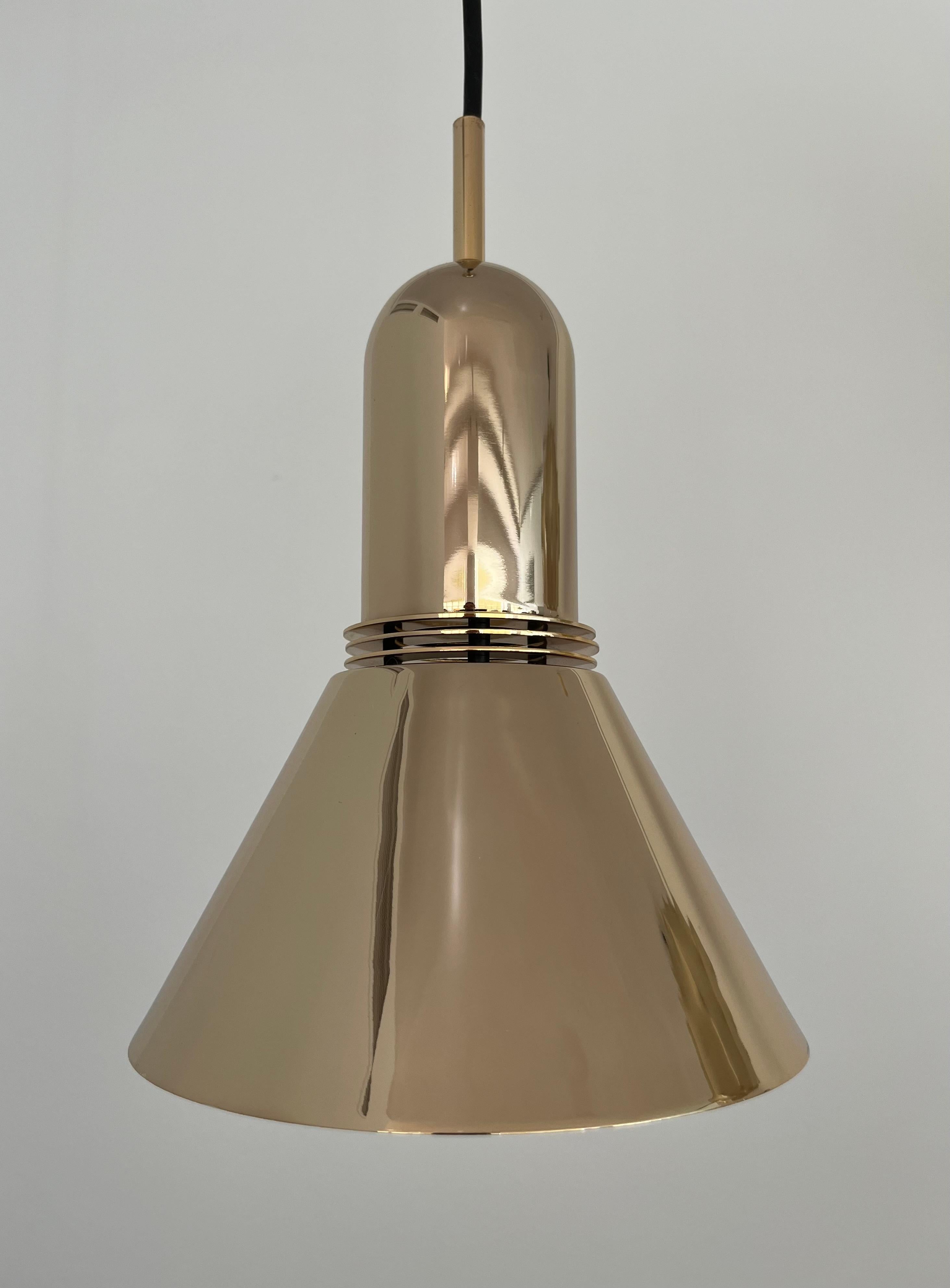 Beautiful and unique Mid-Century Set of Three of Gold Long Chandeliers by Leonardo Marelli for Estiluz. Model: T-1142 Dorado (golden). These fixtures were designed and manufactured in Barcelona (Spain) during 1970s. Exterior: Chrome plating in gold