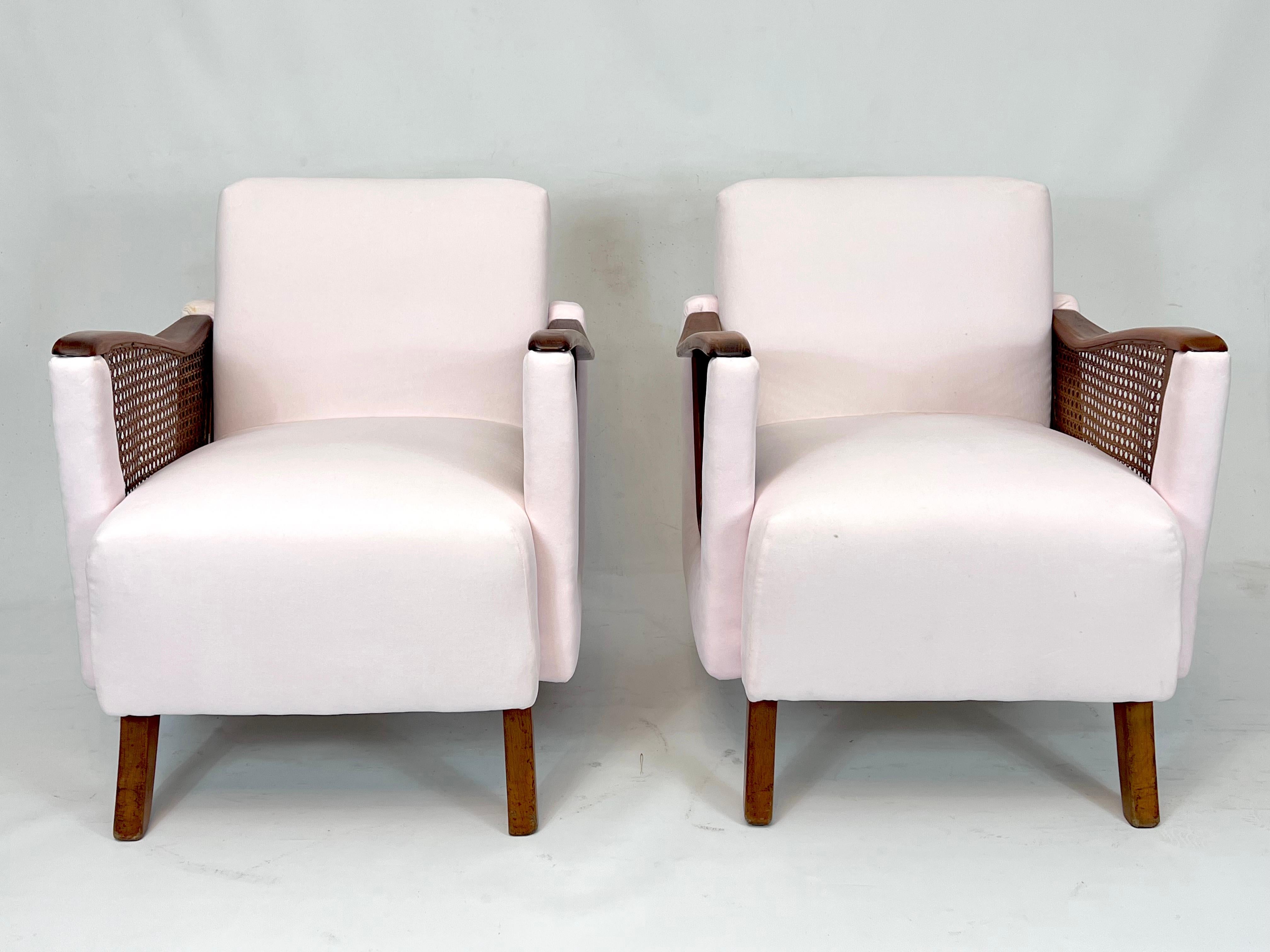 Set of two armchairs made from bright pink velvet, wood and rattan in great general condition. Reupholstered with fine cotton velvet. Produced in Italy during the 50s