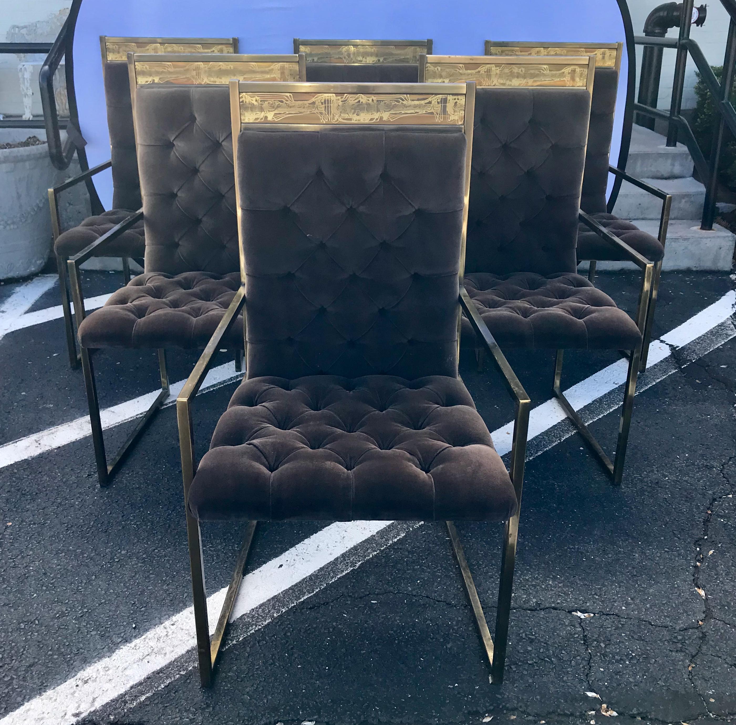 Beautiful matched set of six brass frame dining chairs by Mastercraft, circa 1970s. Designed by Bernard Rohne with original chocolate brown velvet tufted upholstery.  Brass framework has great patina and one of a kind etched artwork at front and