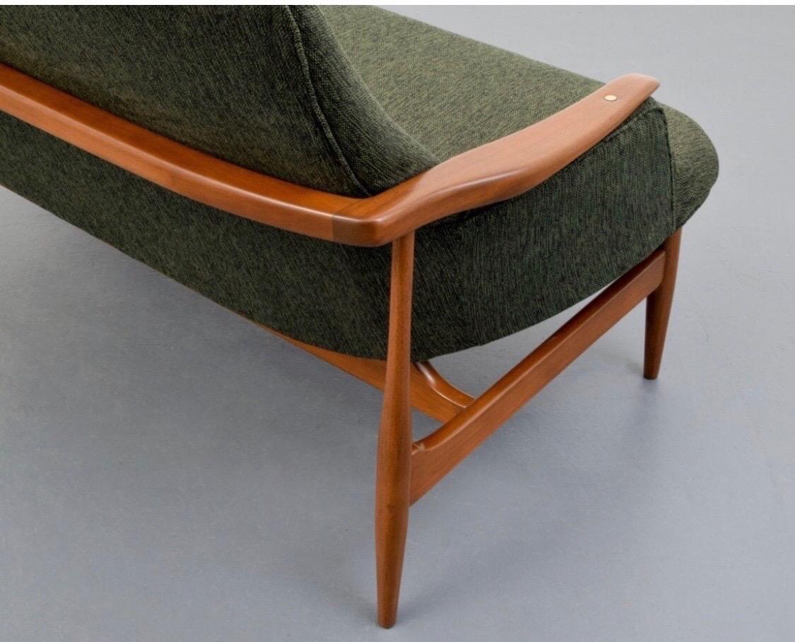 Great, sleek midcentury settee recently upholstered. No markings but very similar to Niels Vodder's model NV53.