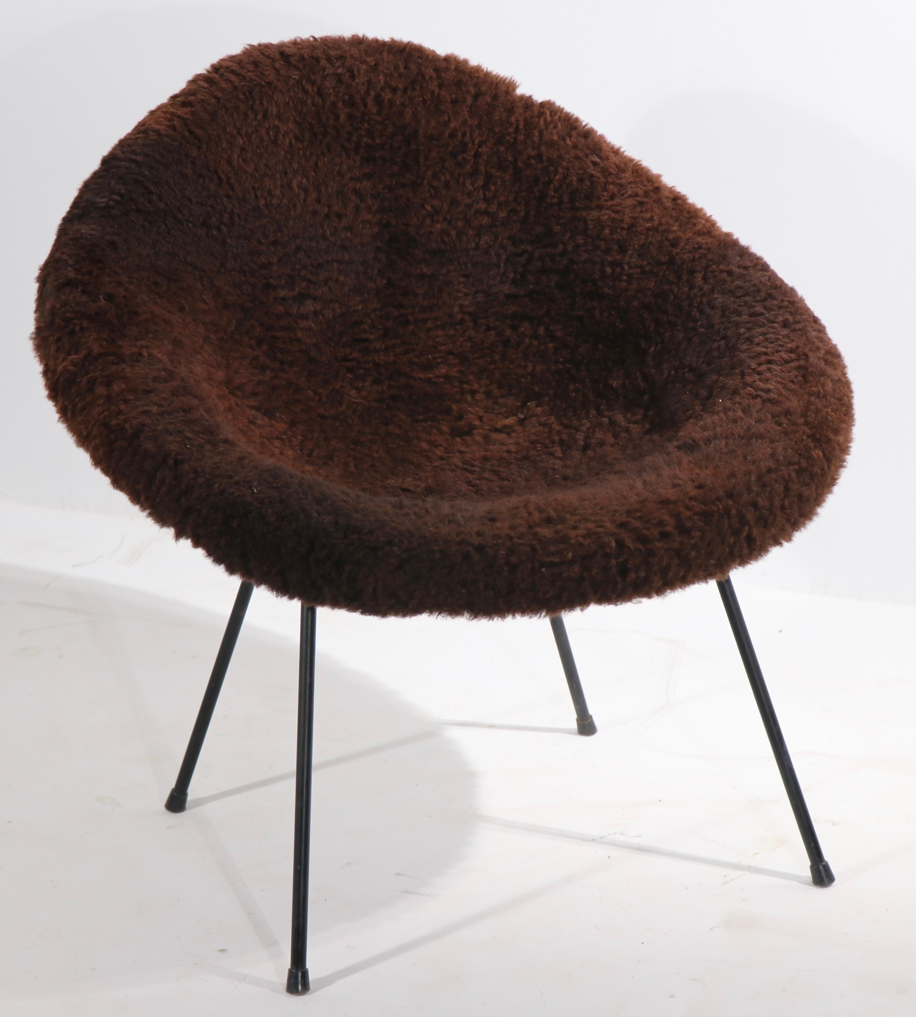 Chic and stylish bucket chair, in brown shag upholstery, marked Sindri, Made in Iceland. This example is in very good, original condition, clean and ready to use.
