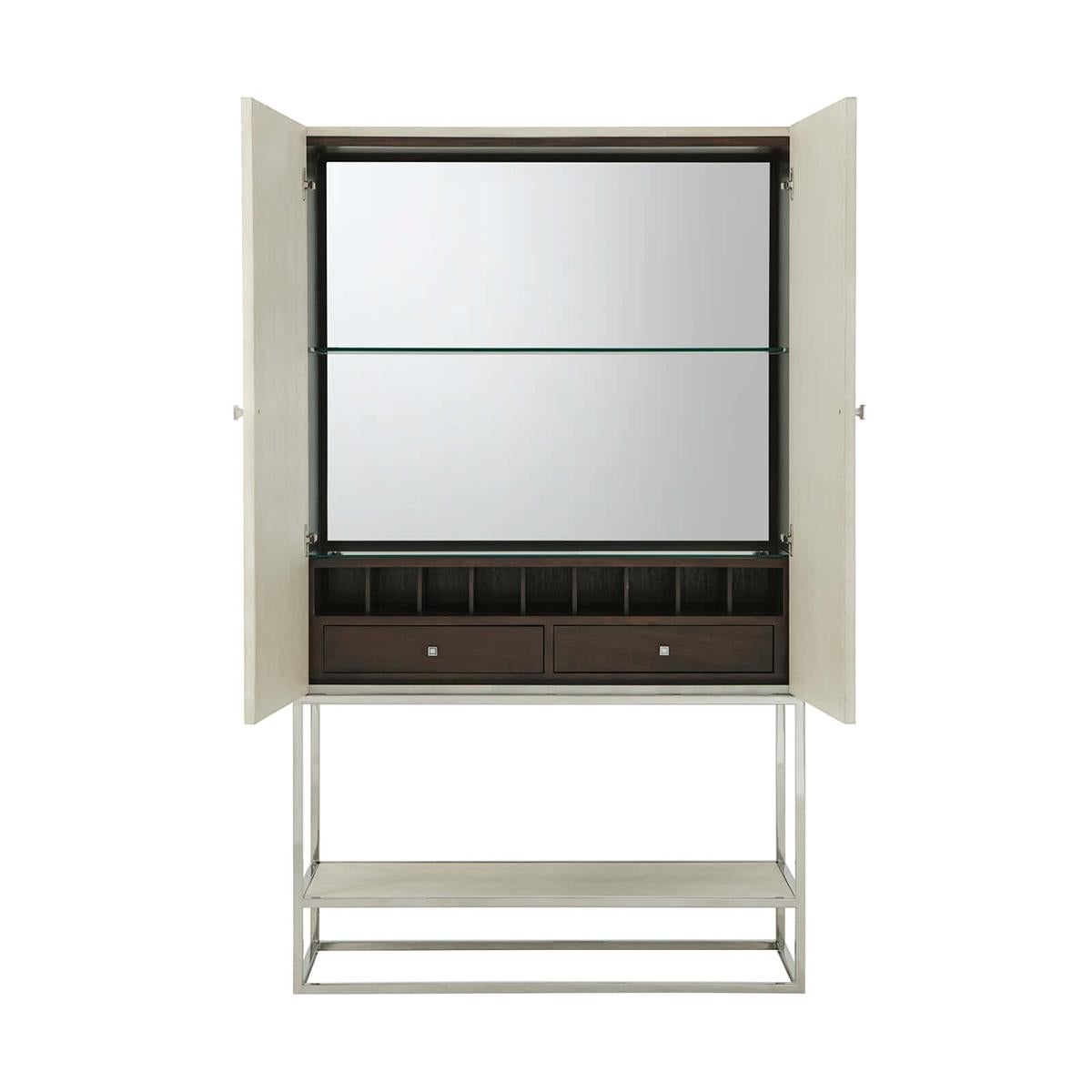 Mid-century Shagreen bar cabinet wrapped in our shagreen embossed leather overcast finish, the interior with a mirrored back and tempered glass shelf and fitted with pigeon holes and two drawers. The frame is a polished nickel finish and has a lower