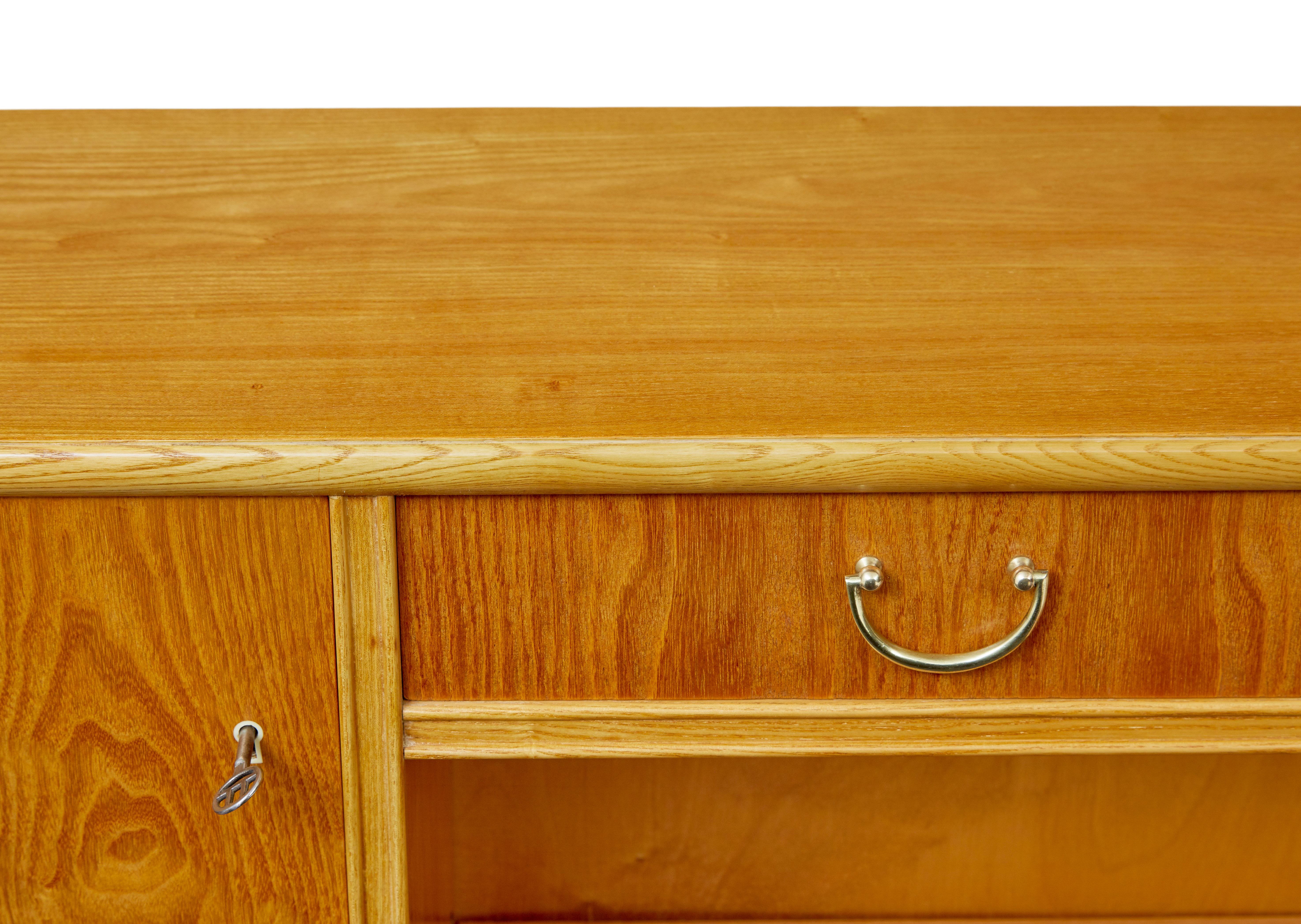 20th Century Mid century shaped Scandinavian elm low open bookcase For Sale