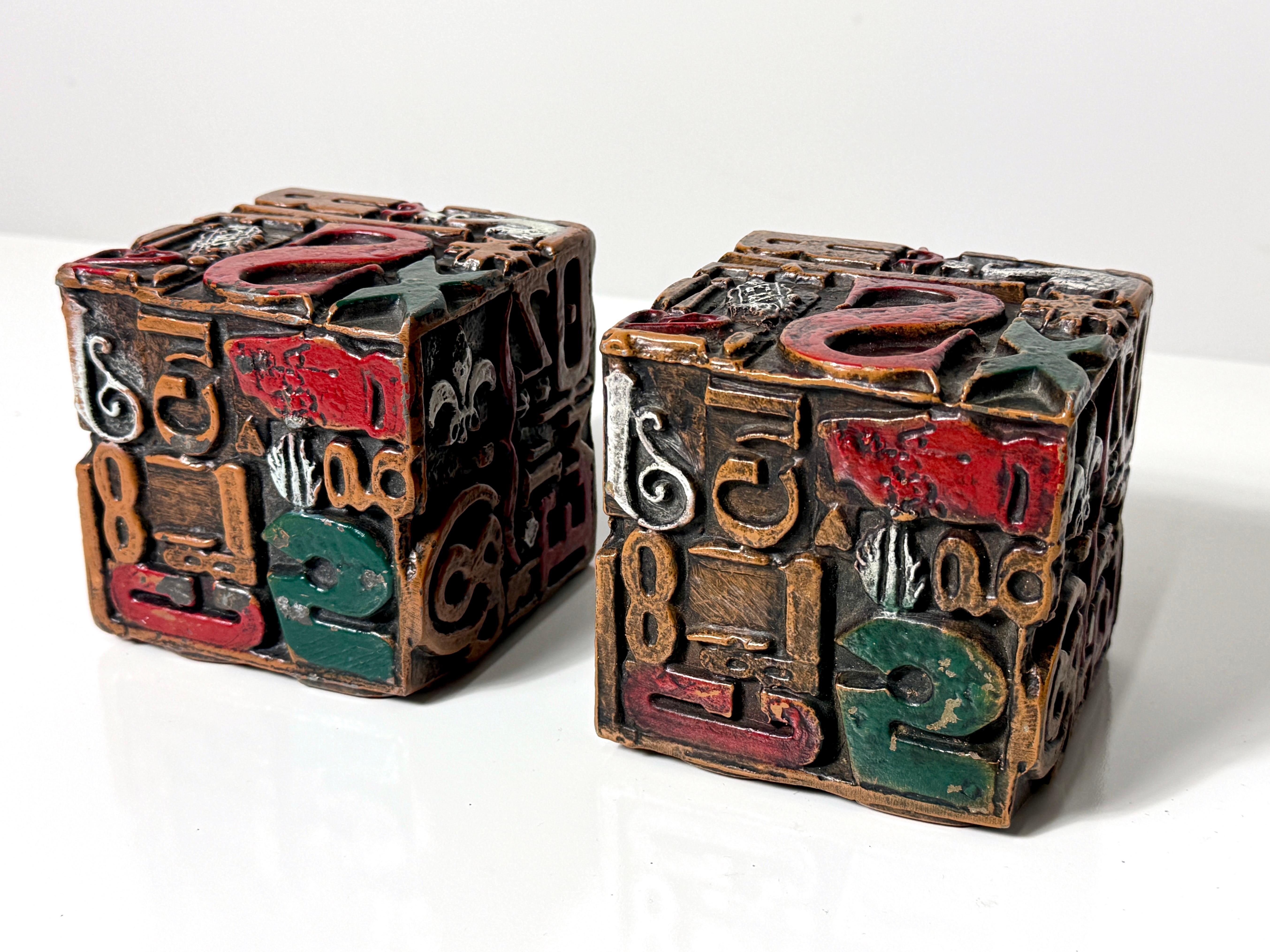 Pair of Mid Century Modern typographic cube sculptures or bookends designed by Sheldon Rose circa 1960s  

Titled 