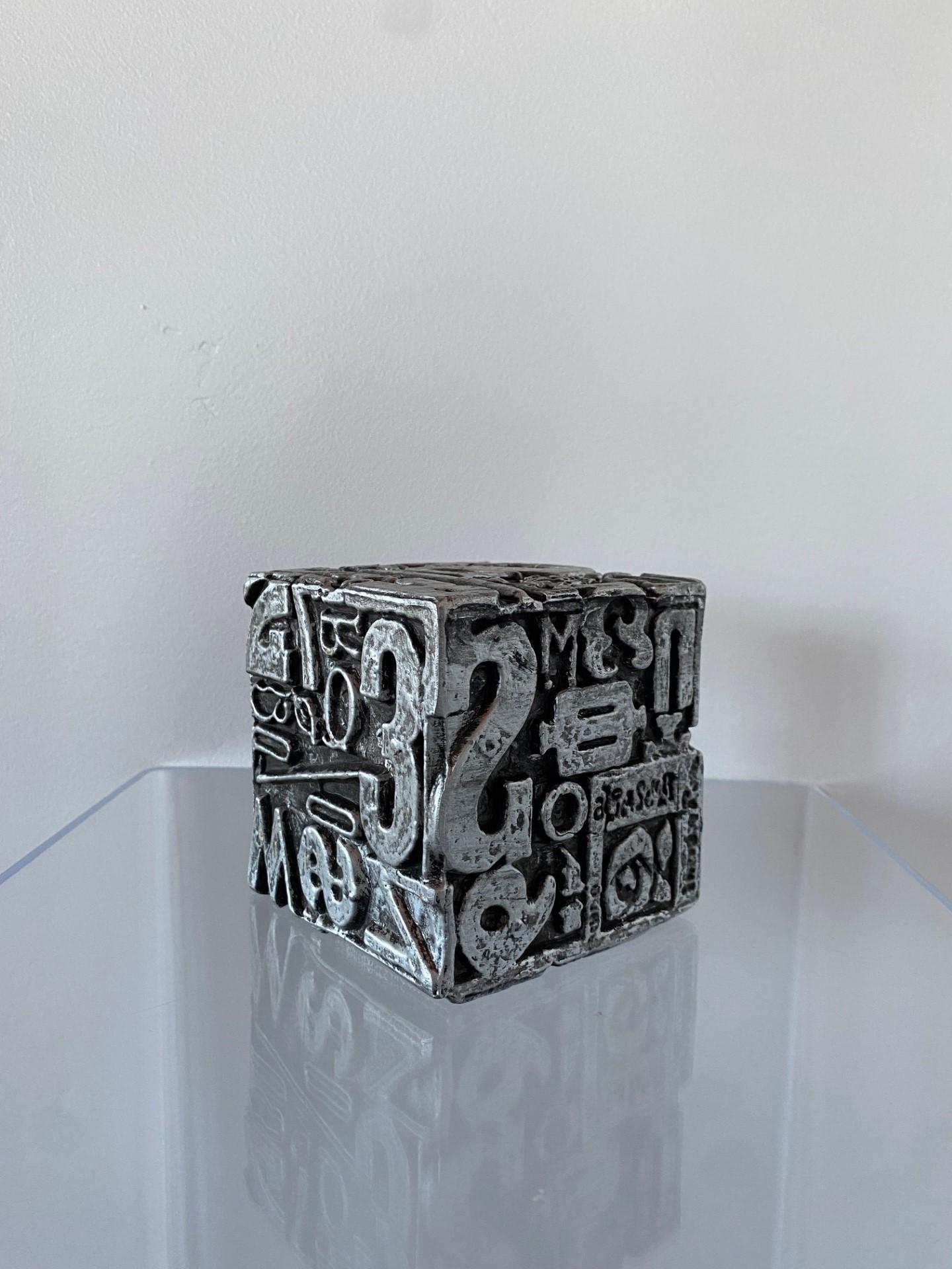 Signed Sheldon Rose (American 20th Century) Typesetter cube sculpture, can also be used as bookend. In polished polychrome silver metal. Sheldon Rose (American, 20th century), attended the Cooper Union in NYC in the 1960s. He is best known for his