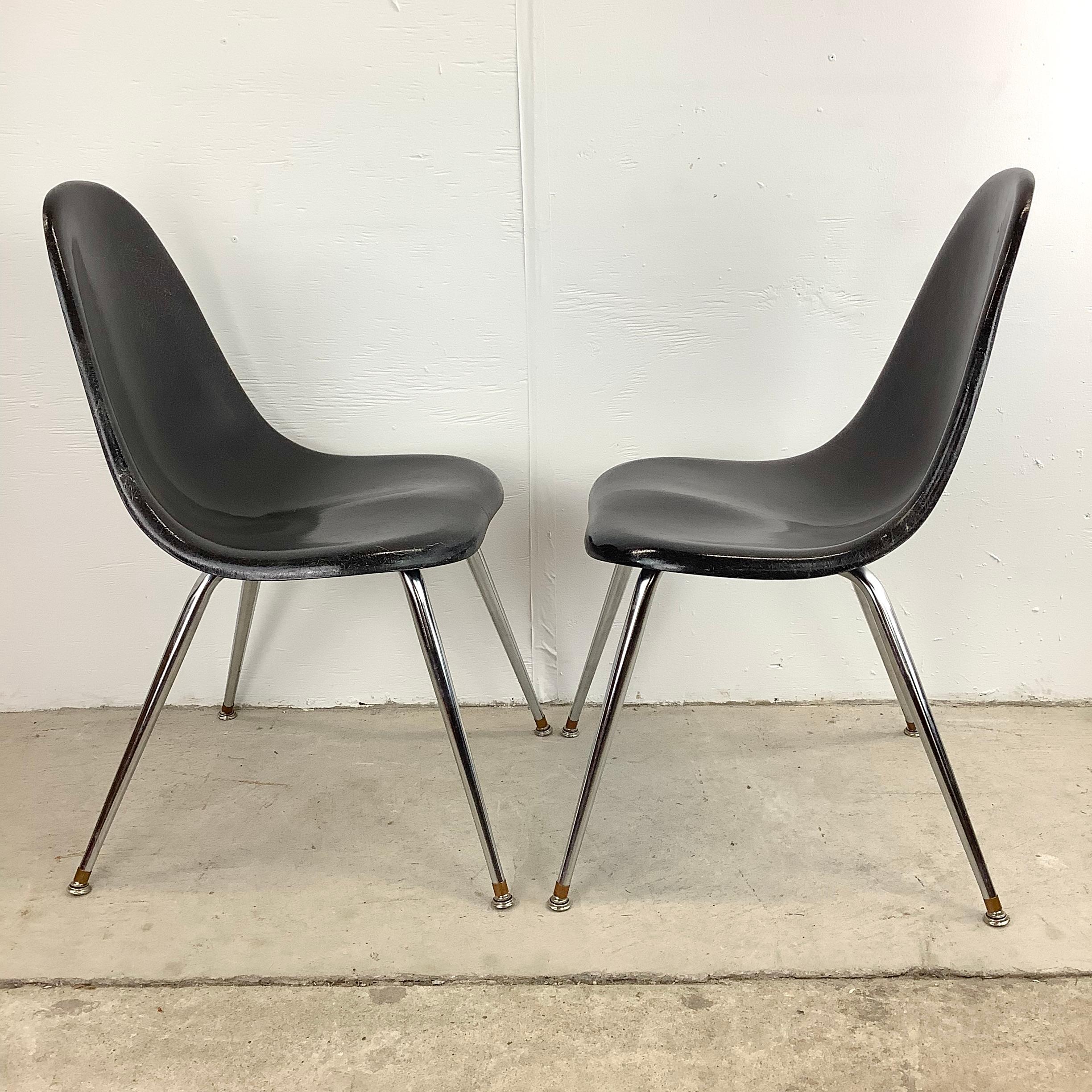 This pair of Mid-Century Molded Fiberglass Shell Side Chairs from Chromcraft make a timeless fusion of mid-century design and modern comfort. These iconic chairs effortlessly capture the essence of an era while providing a touch of sophistication to