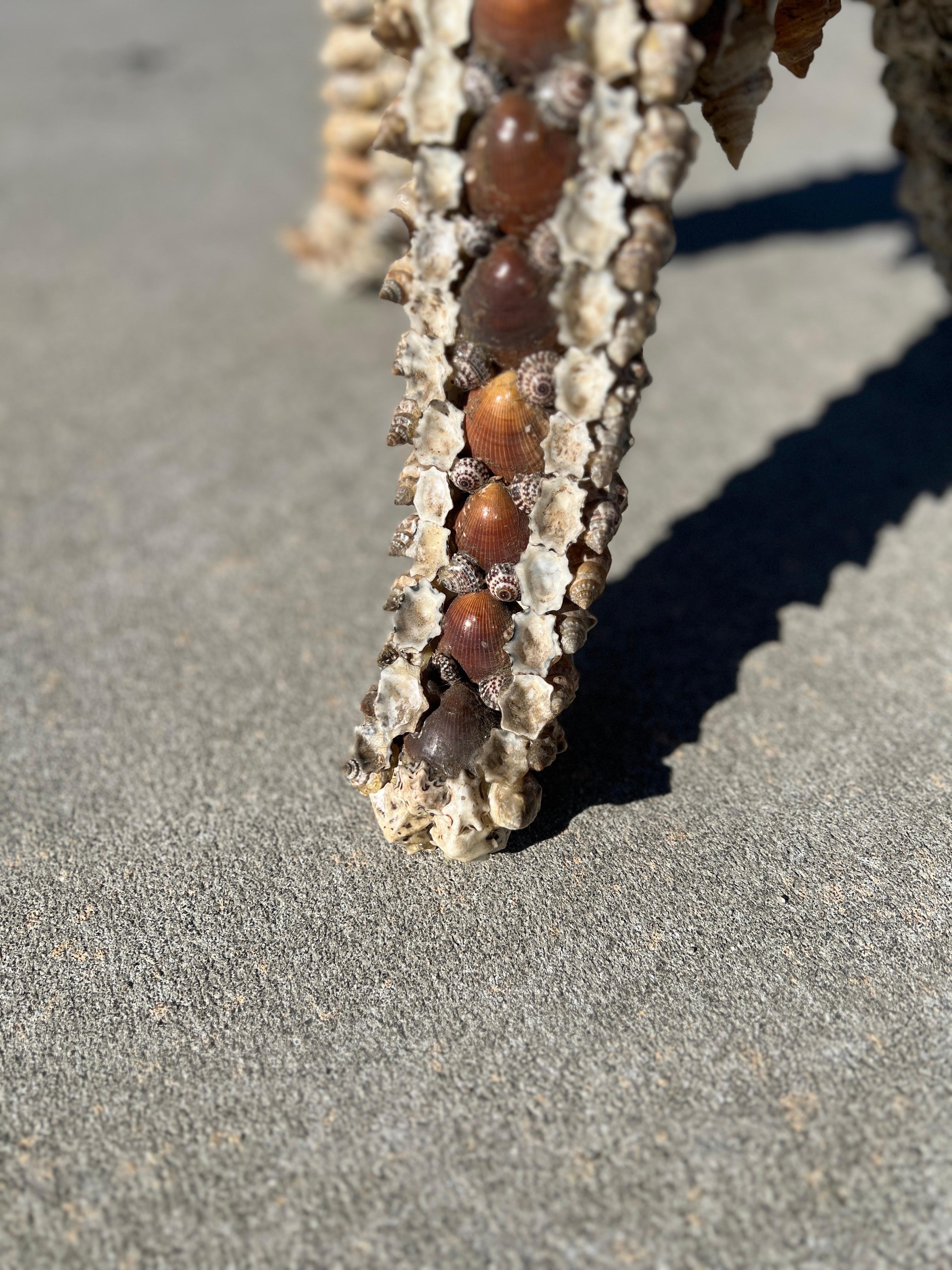 American or Italian, mid 20th century.

A vintage seashell encrusted tripod side table with a fantastic seashell resin set top.
