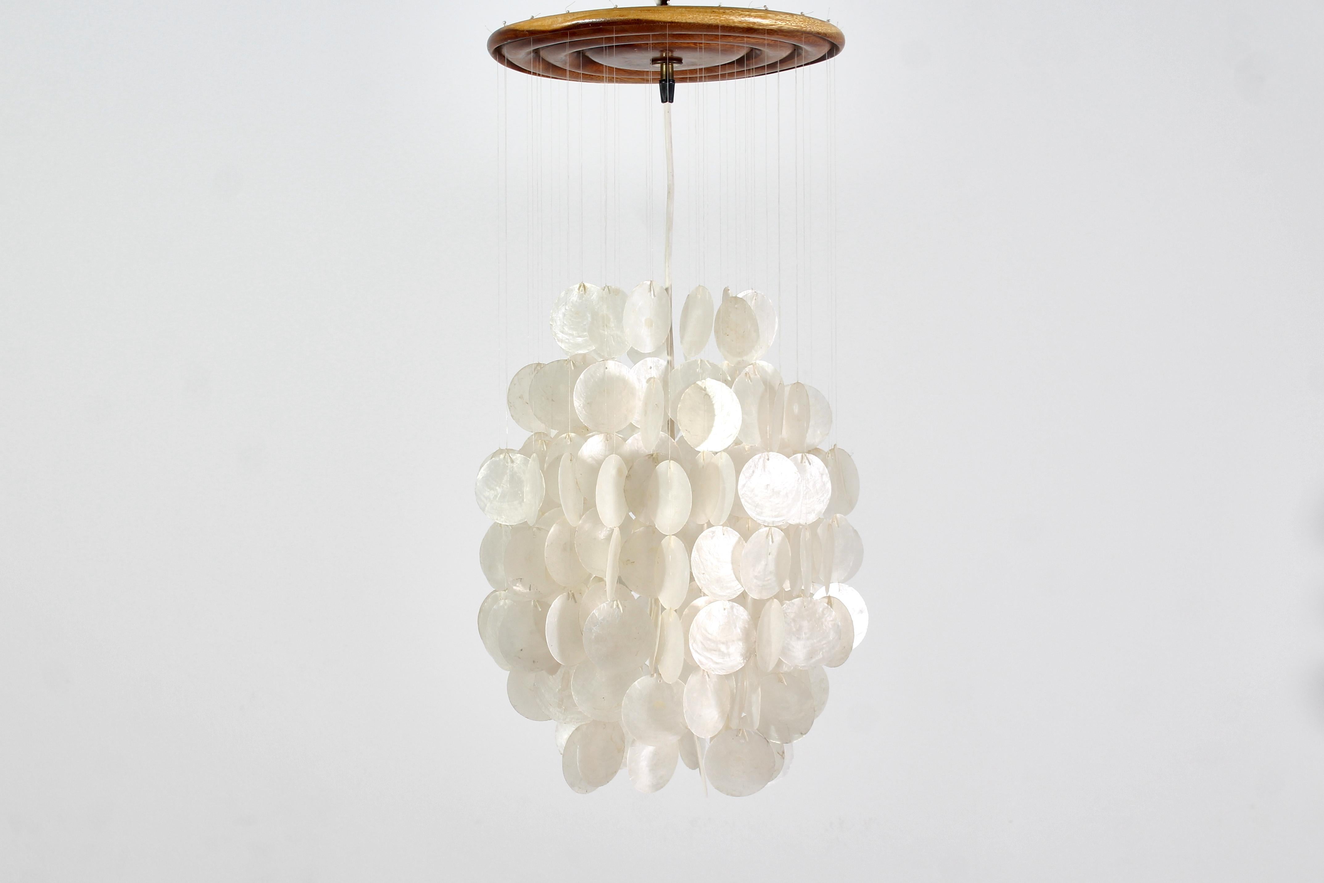 Rare pendant lamp with shell discs held by nylon strings, wooden ceiling light, metal finishes. 
By Verner Panton, manufactured by J. Luber AG, 1960s. Where consistent with age and use.