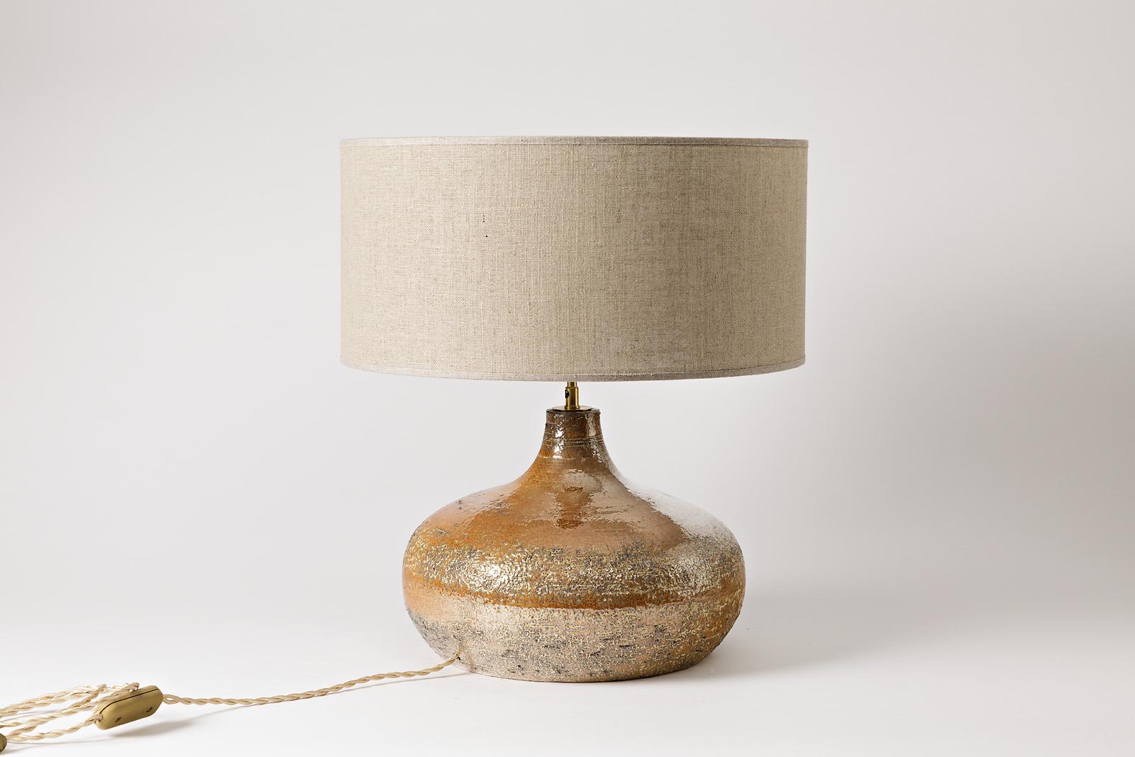 Bessone, Vallauris.

Elegant and shiny midcentury ceramic table lamp singed under the base.

Beautiful gold ceramic glaze color.

Perfect conditions.

circa 1960.

Sold with the lampshade.

Ceramic dimensions: 22 x 29 x 29cm
With