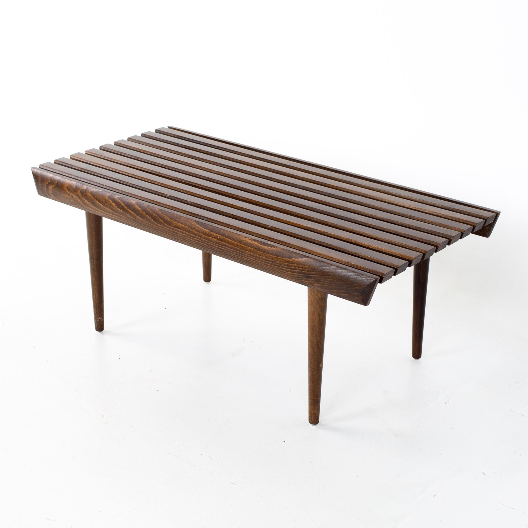 Mid Century short slat bench
Bench measures: 36 wide x 17.5 deep x 14.75 inches high

All pieces of furniture can be had in what we call restored vintage condition. That means the piece is restored upon purchase so it’s free of watermarks, chips