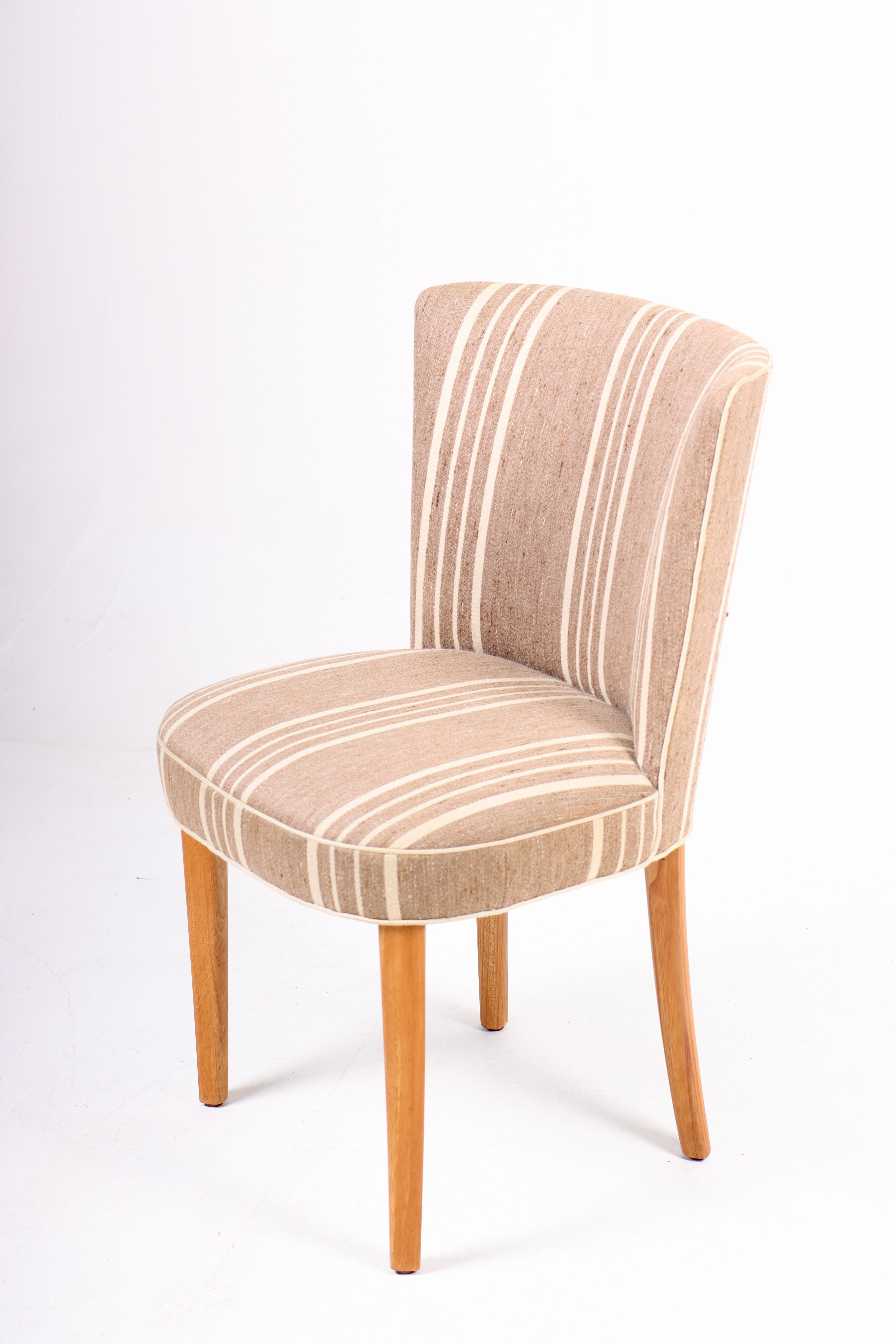 Side chair in fabric, designed by Frode Holm. Made in Denmark, great original condition.