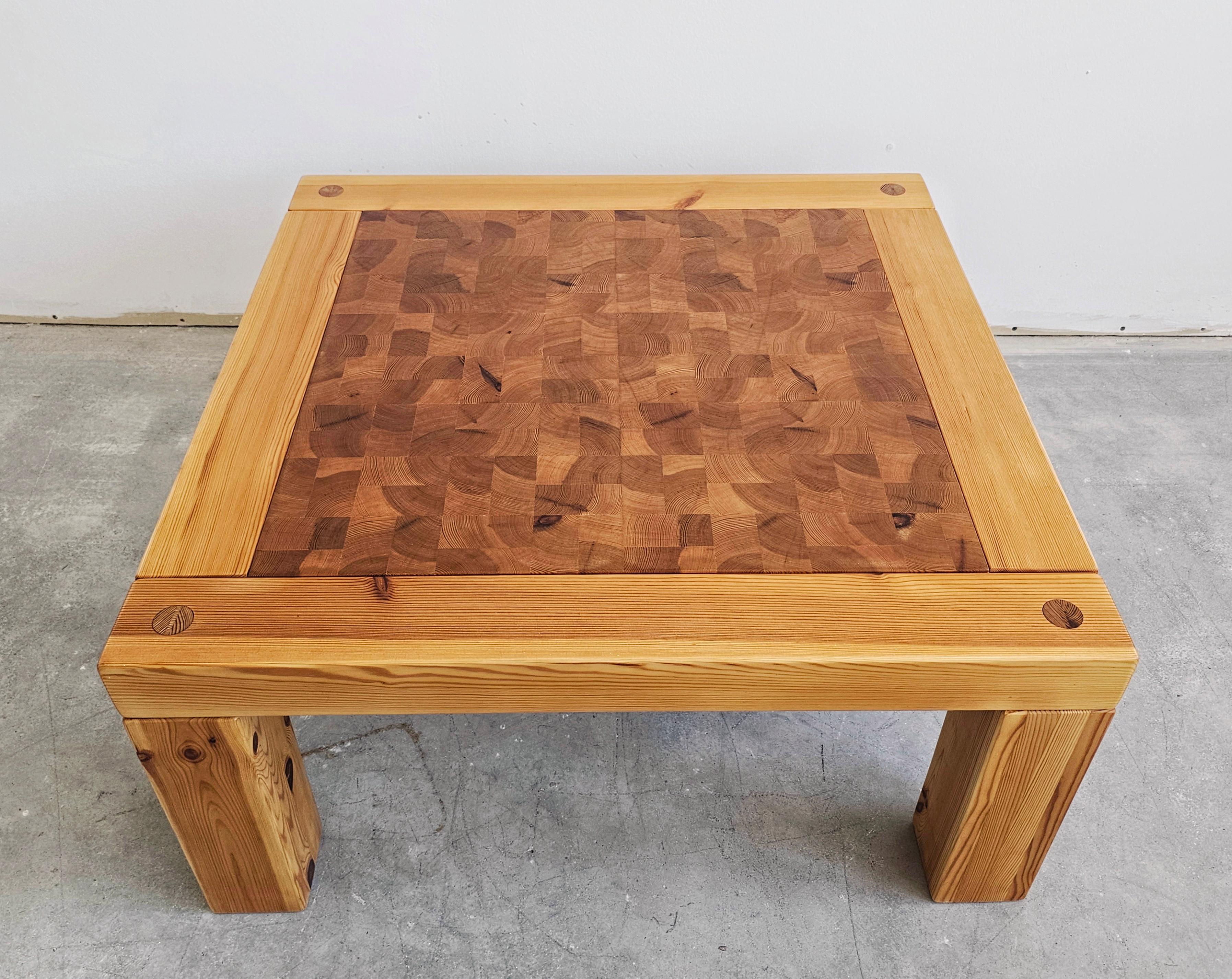 In this listing you will find a gorgeous Mid Century Modern coffee or side table done in pine wood. It features a stunning end grain marquetry detail top which adds a lot of character to the table. Made in Sweden in 1970s.

The table just been fully