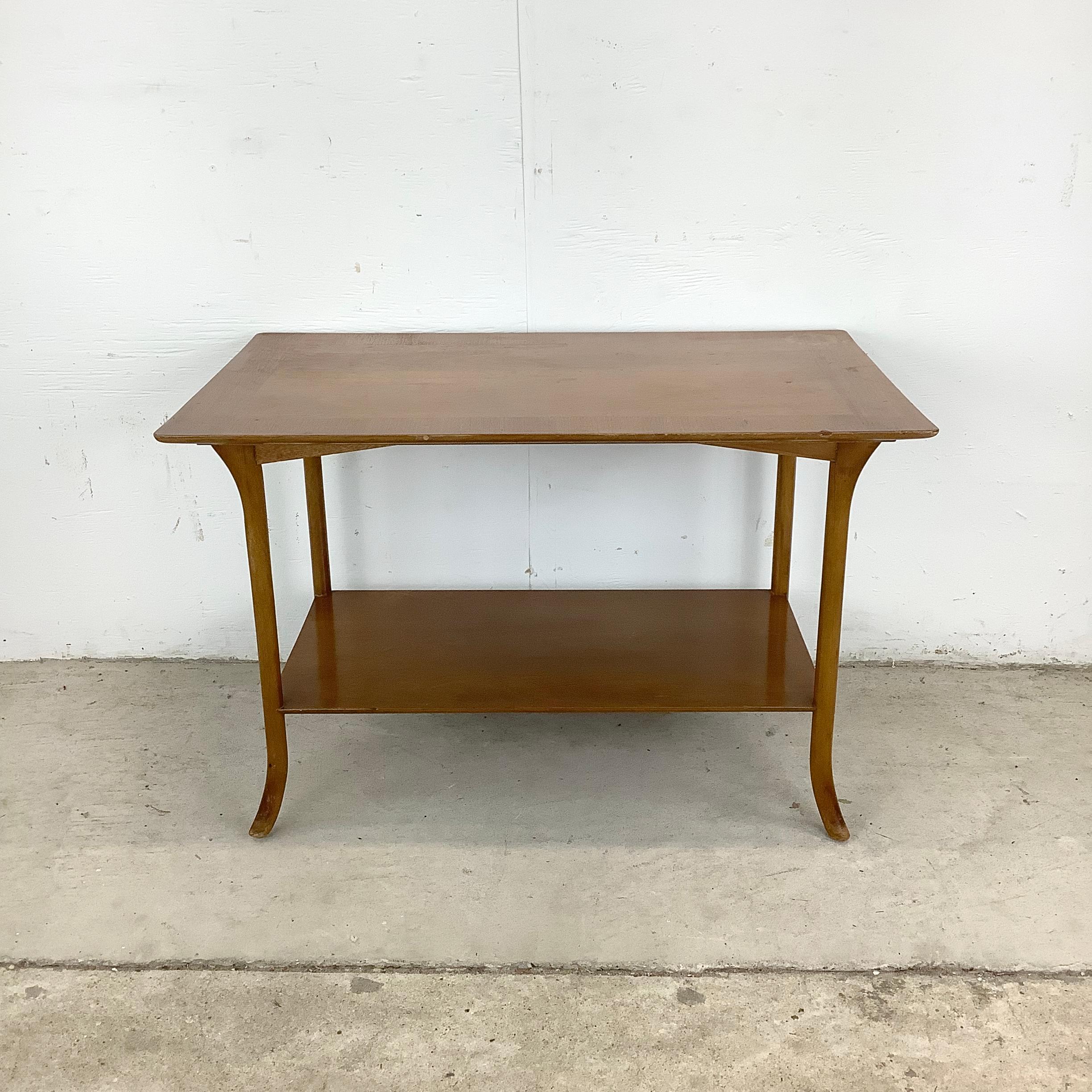 This bleached mahogany side table by Robsjohn-Gibbings brings mid-century refinement into any living space. Its distinctive lines and sculptural silhouette make it a standout piece while remaining versatile enough for everyday use.

The unique