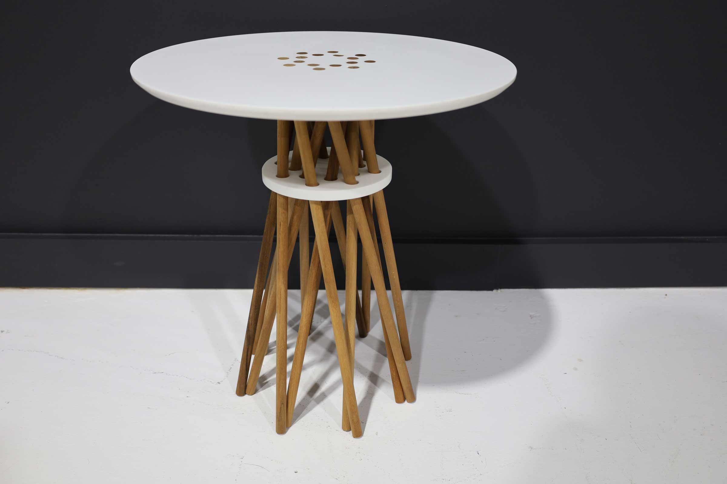 A fantastic mid century side table with spindle legs and a corian top. Well constructed. Signed 