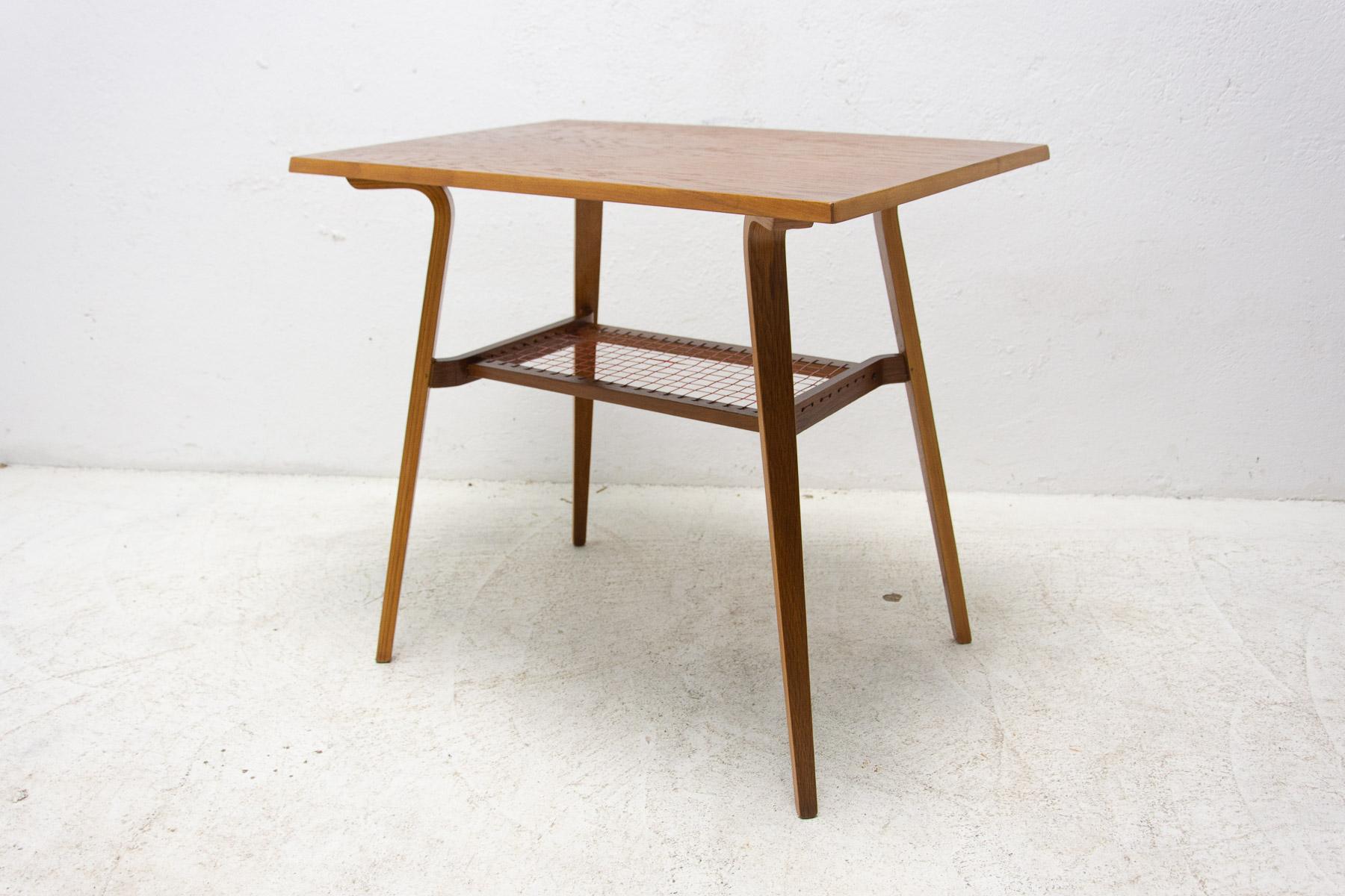 This mid century side table was made in the former Czechoslovakia in the 1970´s. It was produced by Drevopodnik Holešov company. It´s made of oak. In very good Vintage condition, shows slight signs of age and using. Associated with world-renowned