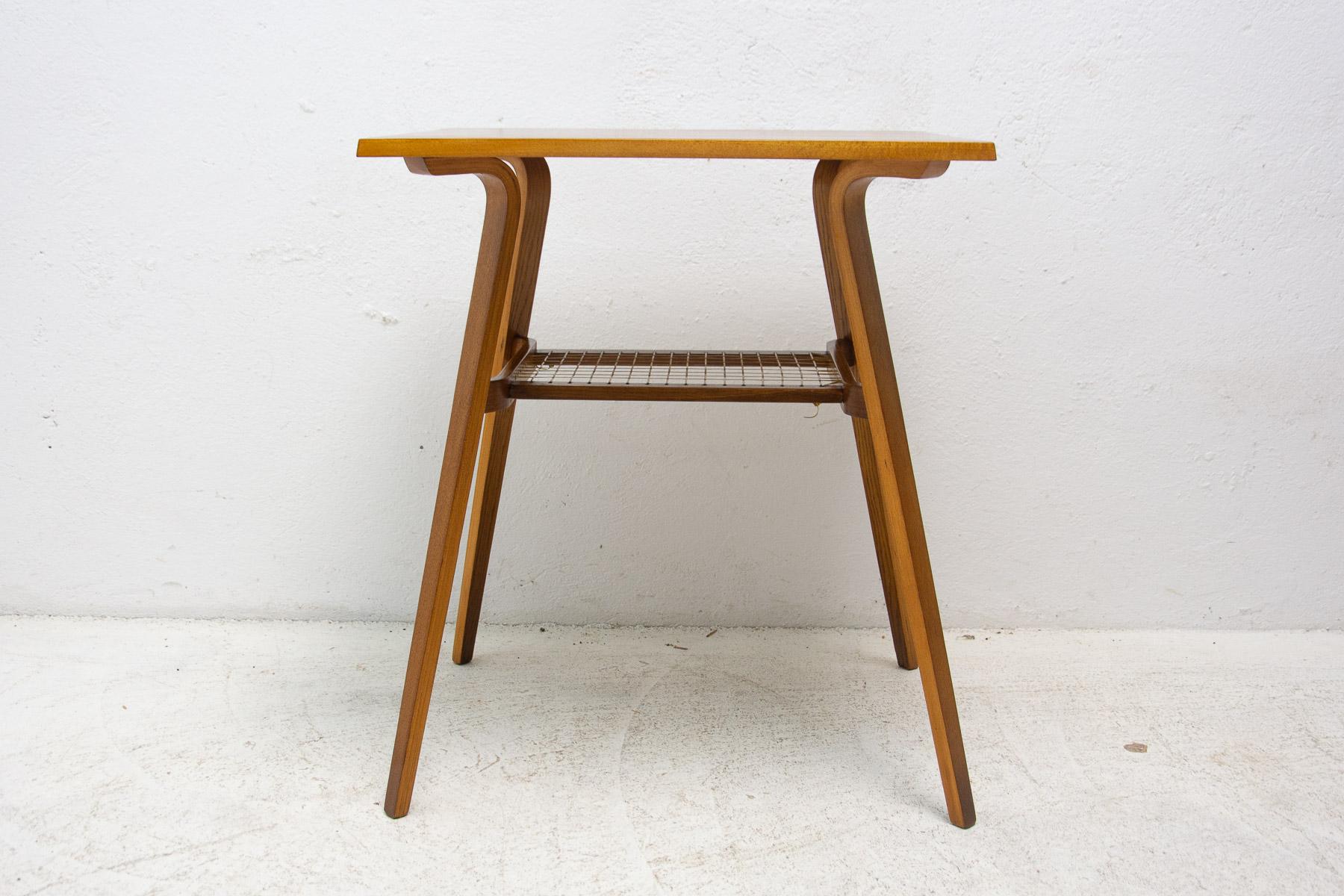 This mid century side table was made in the former Czechoslovakia in the 1970´s. It was produced by Drevopodnik Holešov company. It´s made of oak. In very good Vintage condition, shows slight signs of age and using. Associated with world-renowned