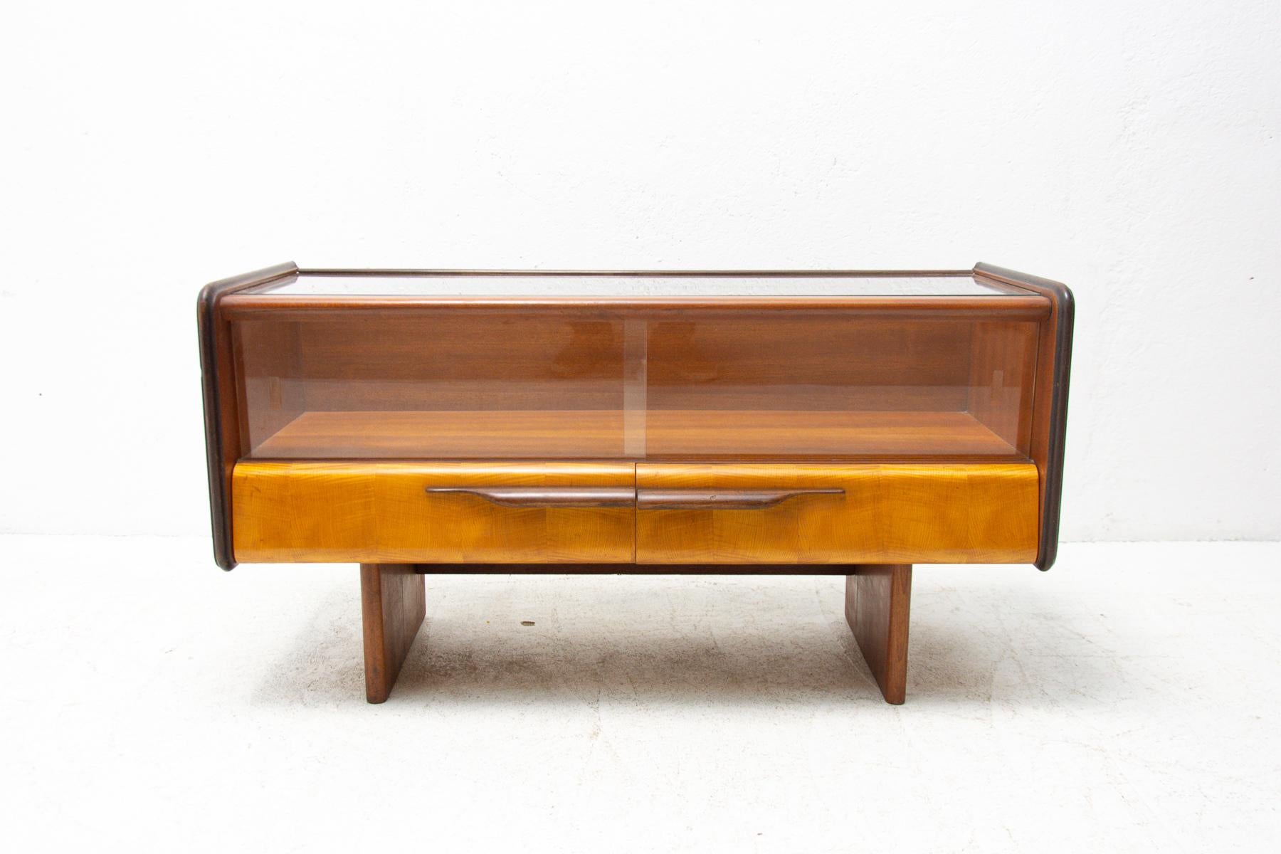 Mid century side table or glazed cabinet, made by ÚP Závody in the former Czechoslovakia in the 1960s. Made in a combination of ash, elm, walnut, birch and mahogany. Glazed upper part. It´s in good Vintage condition, shows slight signs of age and