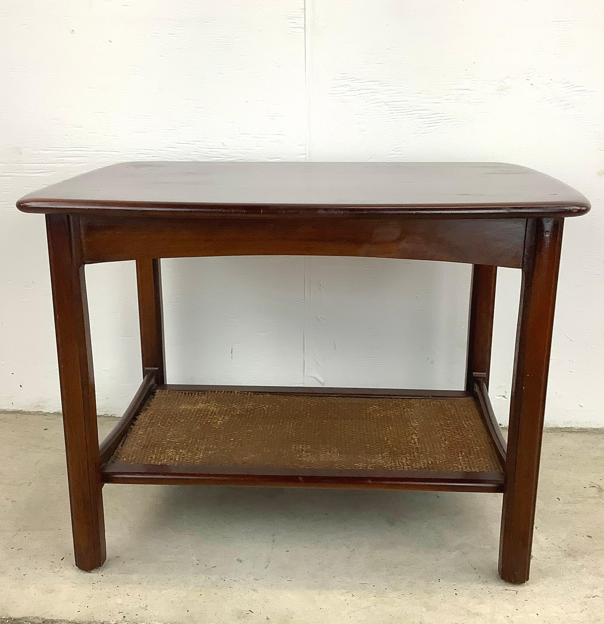 This simple yet striking mid-century side table seamlessly combines style, functionality, and a touch of vintage charm. The perfect lamp table or end table for any living space, this two tier table adds a touch of sophistication and practicality.