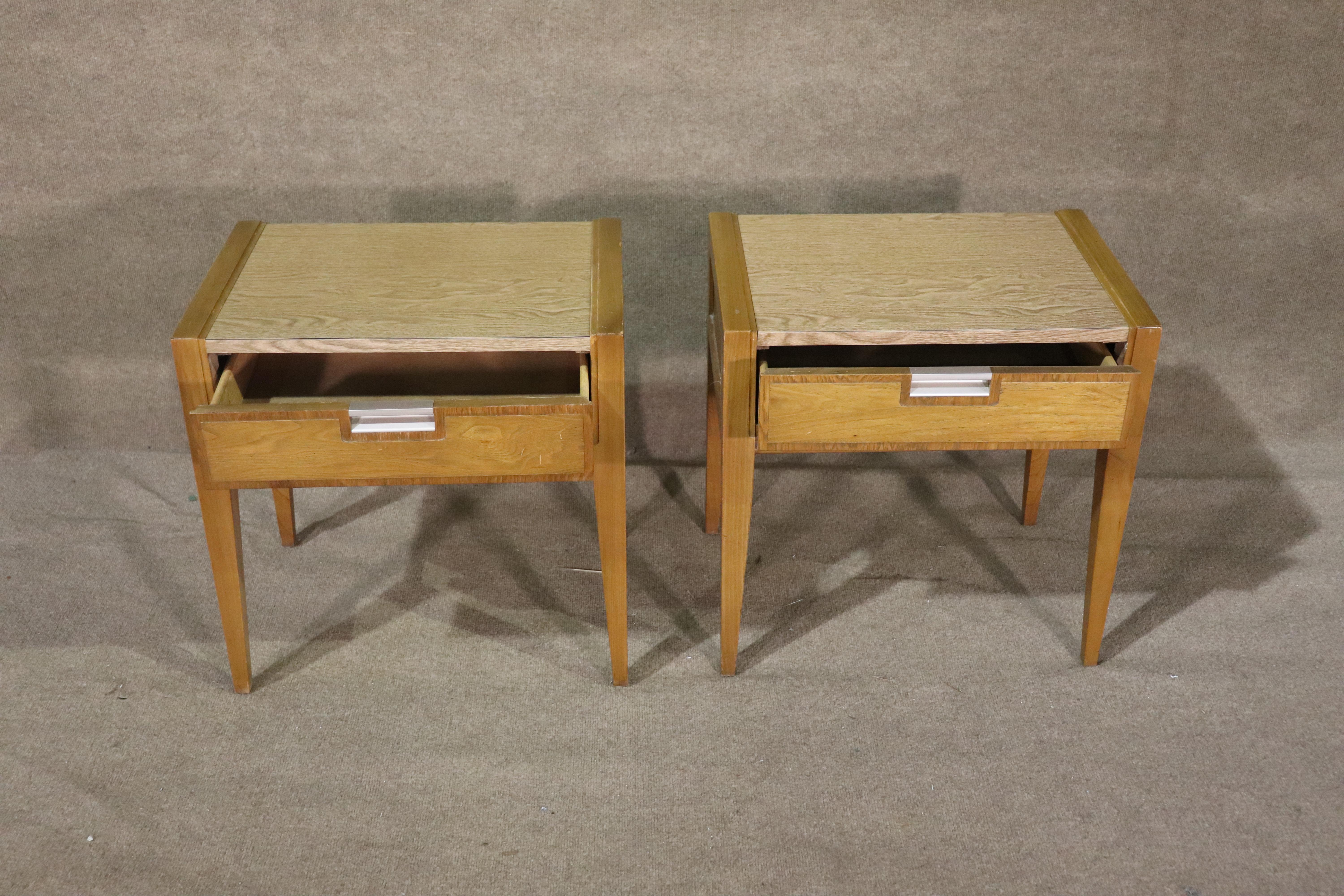 Pair of mid-century modern end tables made by Basic Witz. Made of walnut with laminate tops. Great for use with no worries of water damage. Fine attention to detail with fine trim around the drawers.
Please confirm location NY or NJ