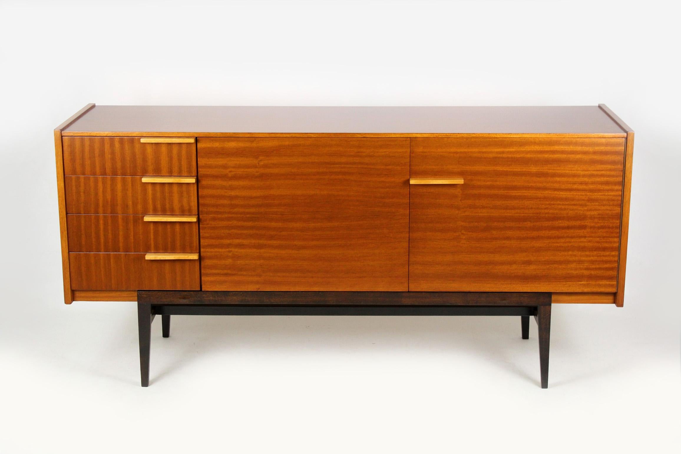 Midcentury sideboard, designed by František Mezulaník for UP Bucovice in former Czechoslovakia in the 1960s.
It features four drawers and three shelves.