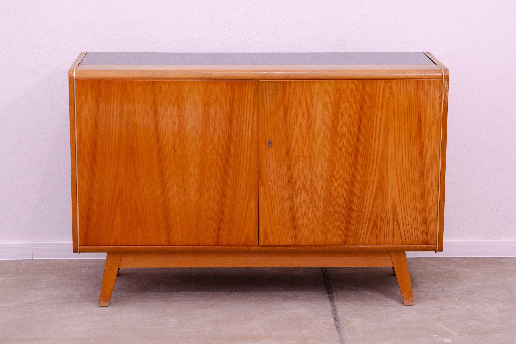 This mid century sideboard was designed by Hubert Nepožitek & Bohumil Landsman for Jitona company in the 1960´s. Material: beech wood, opaxite glass. In good Vintage condition, showing signs if age and using.

Height: 78 cm

lenght: 118 cm

width: