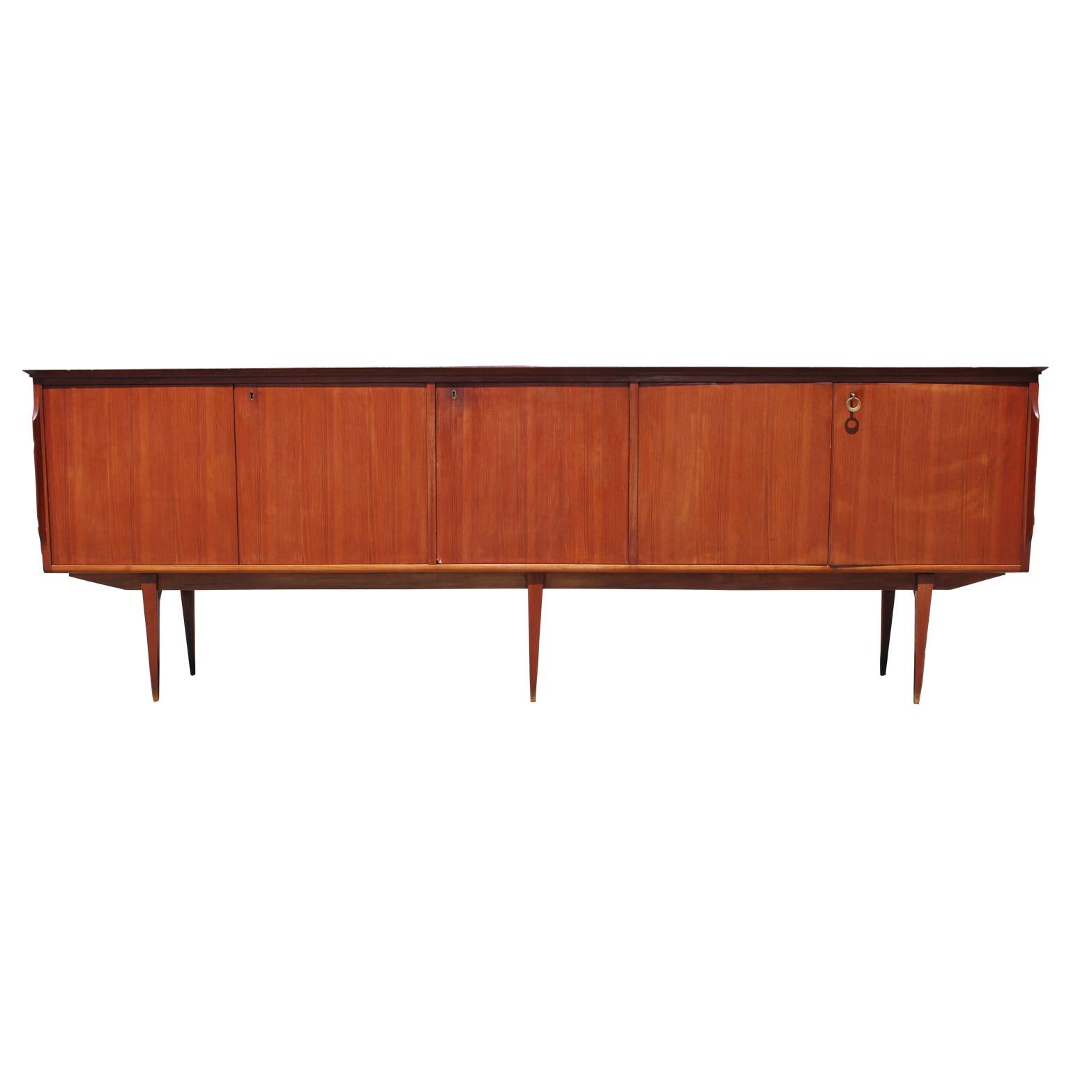 Stylish Mid-Century Modern credenza in the style of Ib Kofod Larsen. It features extra drawers inside the sideboard for added storage space.