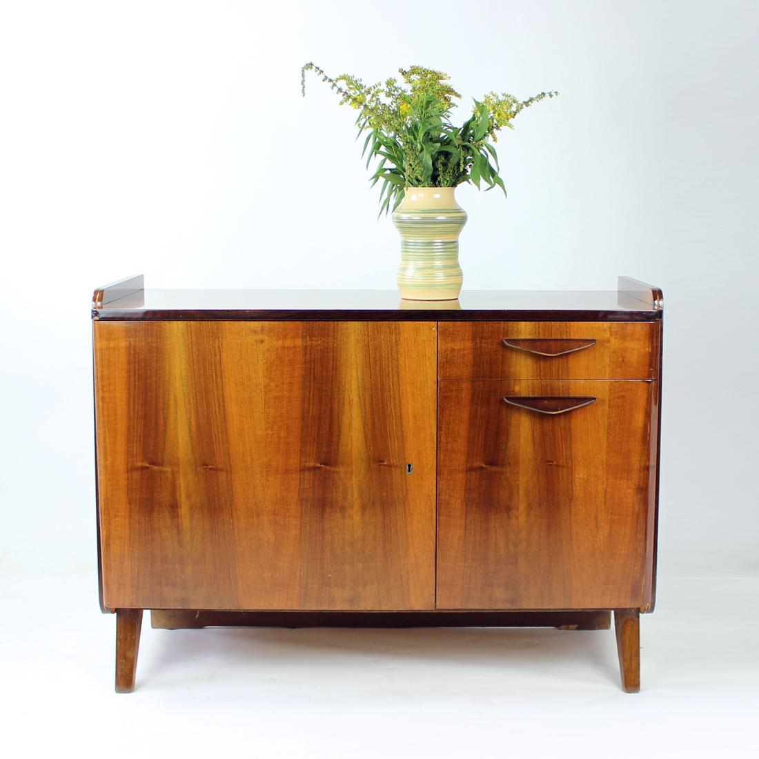 Beautiful mid-century sideboard in a blond wood. Produced by Tatra company in Czechoslovakia. Original label still attached on the back with the year of the production visible. The sideboard stands as a solid and beautiful piece. The wood has a