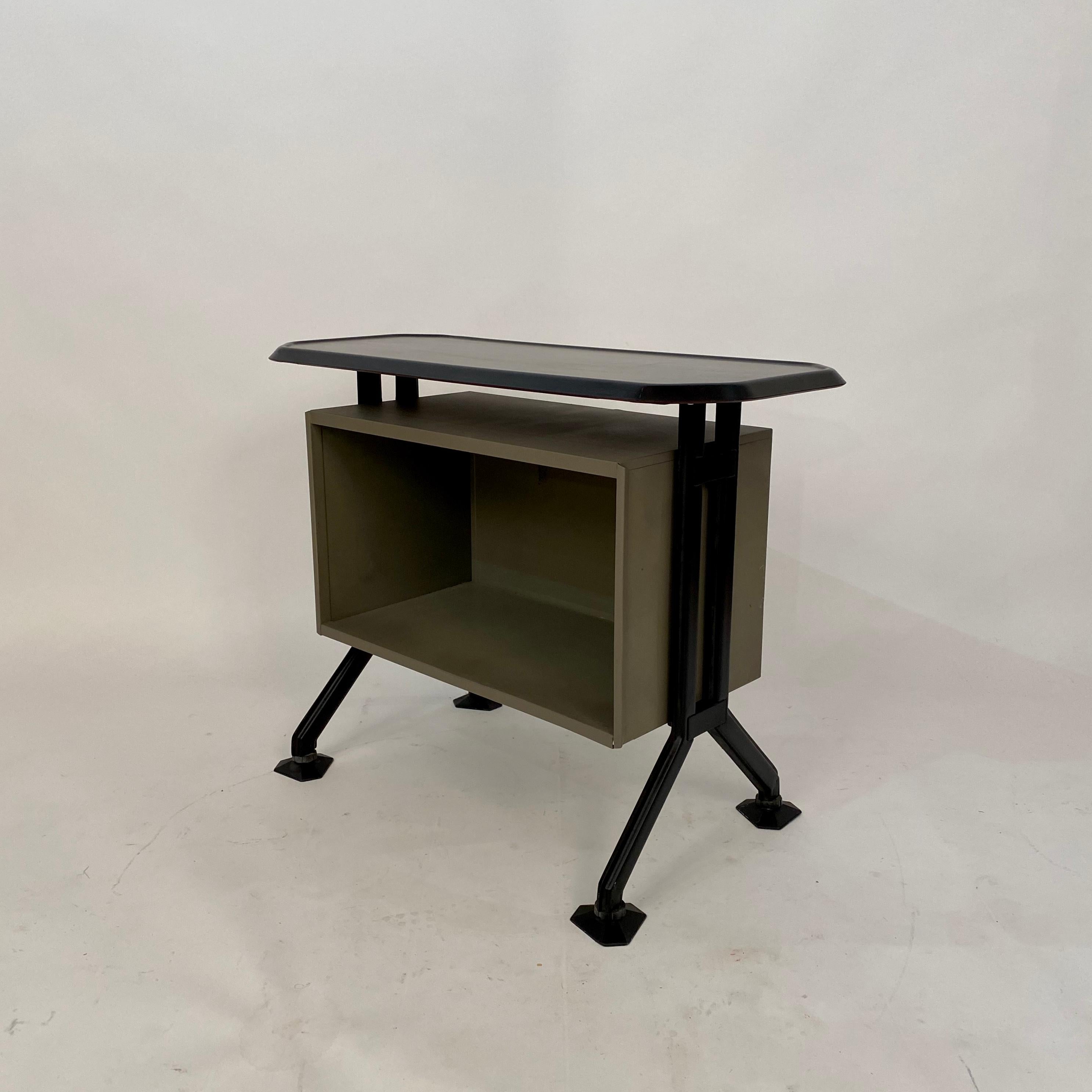 This midcentury sideboard or office cabinet was designed by B.B.P.R. for Olivetti in Italy circa 1963. It is from the Arco Series.
It is made out of lacquered metal, plastic and pressed pear wood.
A unique piece which is a great eye-catcher for