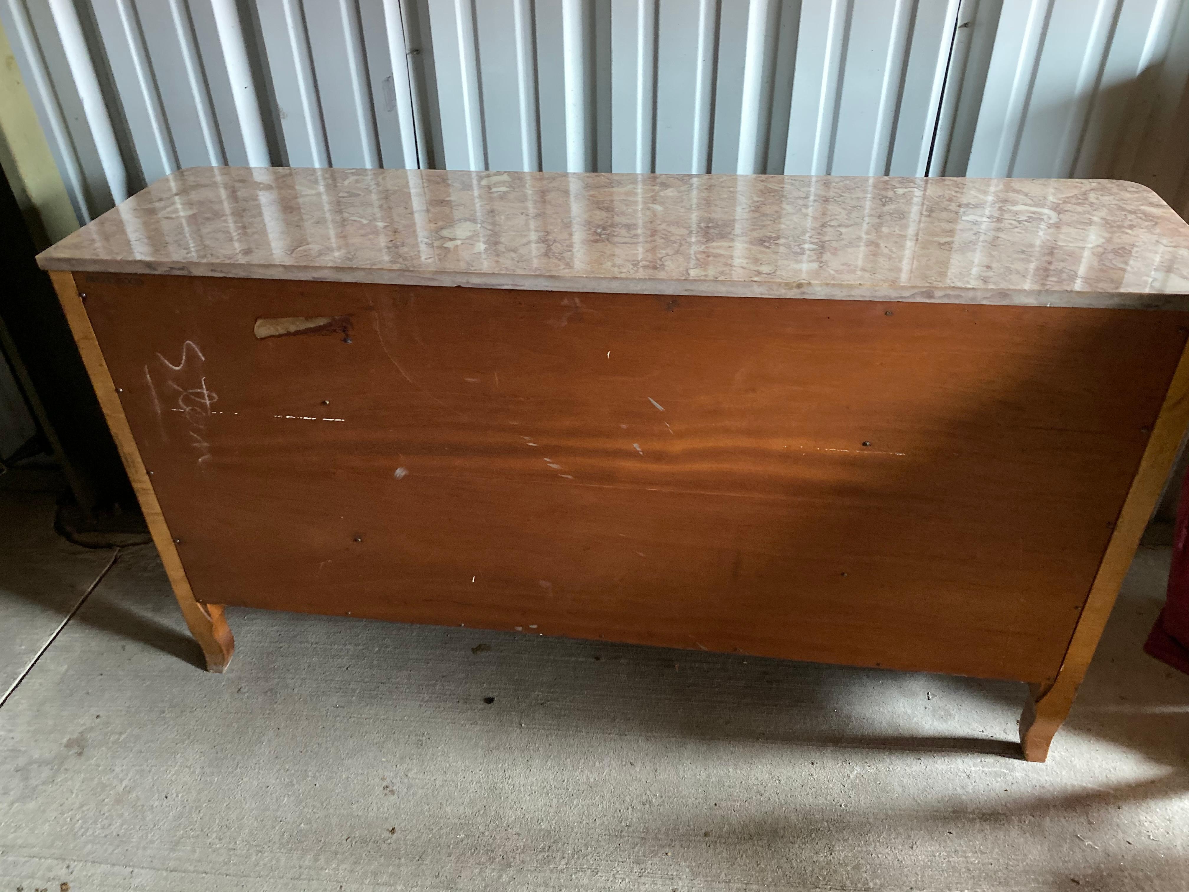 Midcentury sideboard or credenza Secretairie
Marble topped credenza; scalloped edges, side cabinets with shelving, and the most beautiful pull-out secretaire desk with small drawers and cubbies.
Beautifully designed and made midcentury