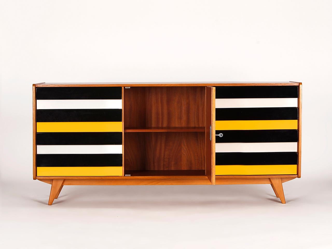 This model U-460 sideboard was designed by Jiri Jiroutek for Interier Praha in former Czechoslovakia. Produced in the 1960s. Completely restored. It is an early model with wooden drawers. Excellent condition. Delivery time 3-4 weeks.

