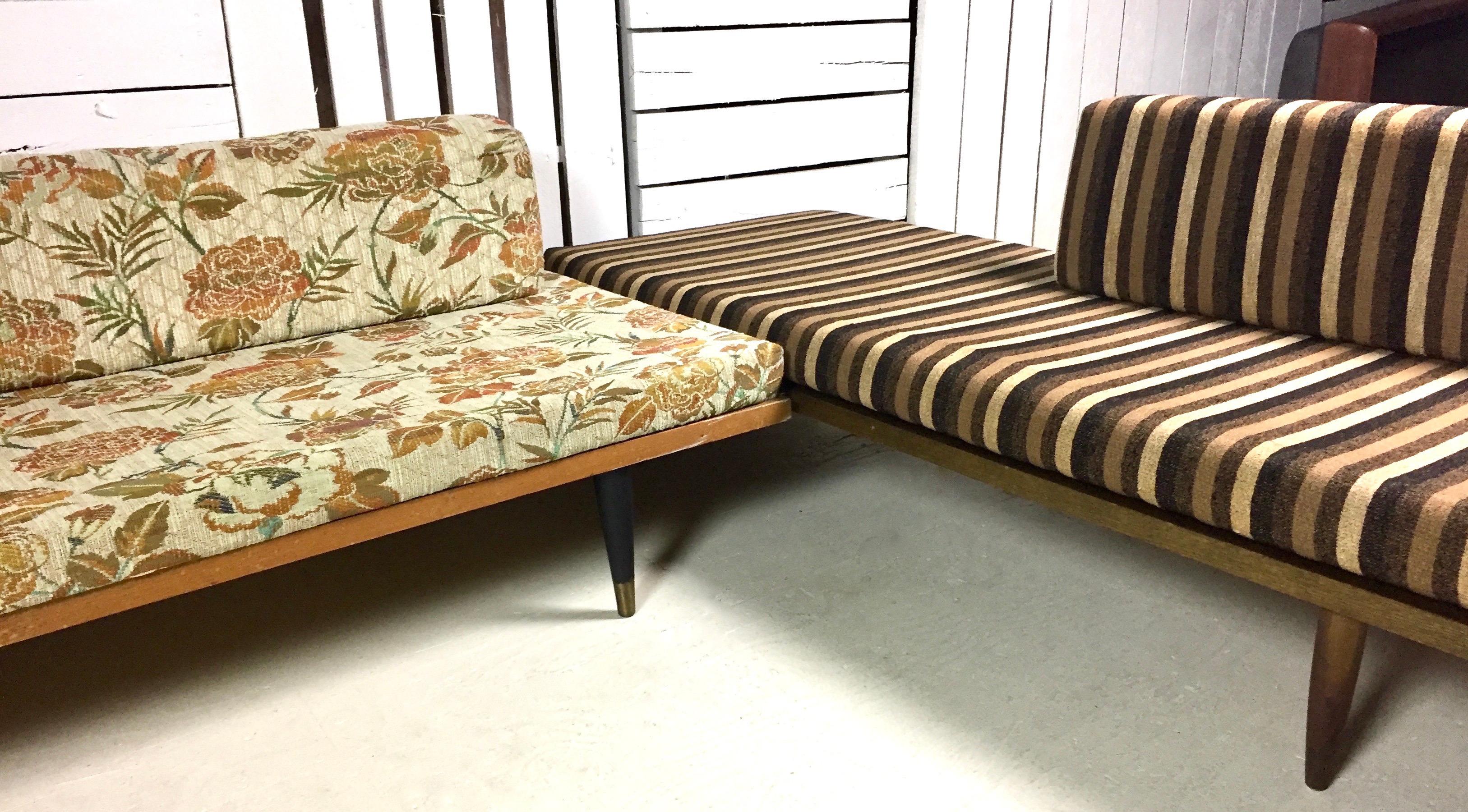 Adrian Pearsall two-piece sectional sofa by Craft Associates, circa 1960s. The left portion has a non-original red, orange and green floral print and the right side has the original two-tone brown and cream striped cotton upholstery. The left daybed