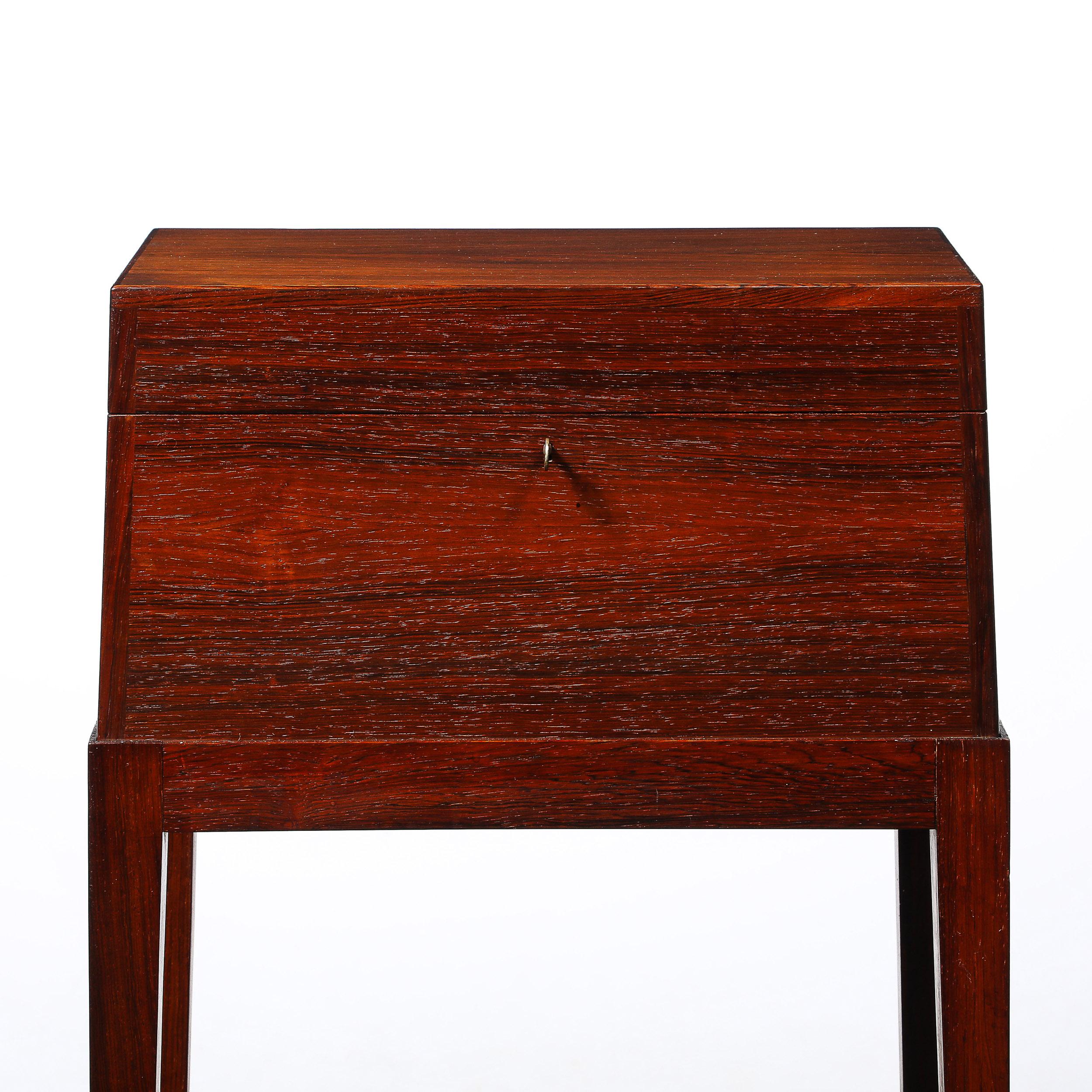 Introduce a touch of timeless elegance to your home with the Mid-Century Modernist Silver Chest in Book-Matched Teak with Sculptural Handles in Macassar Ebony, an extraordinary piece crafted in the United States, Circa 1960. This exquisite chest