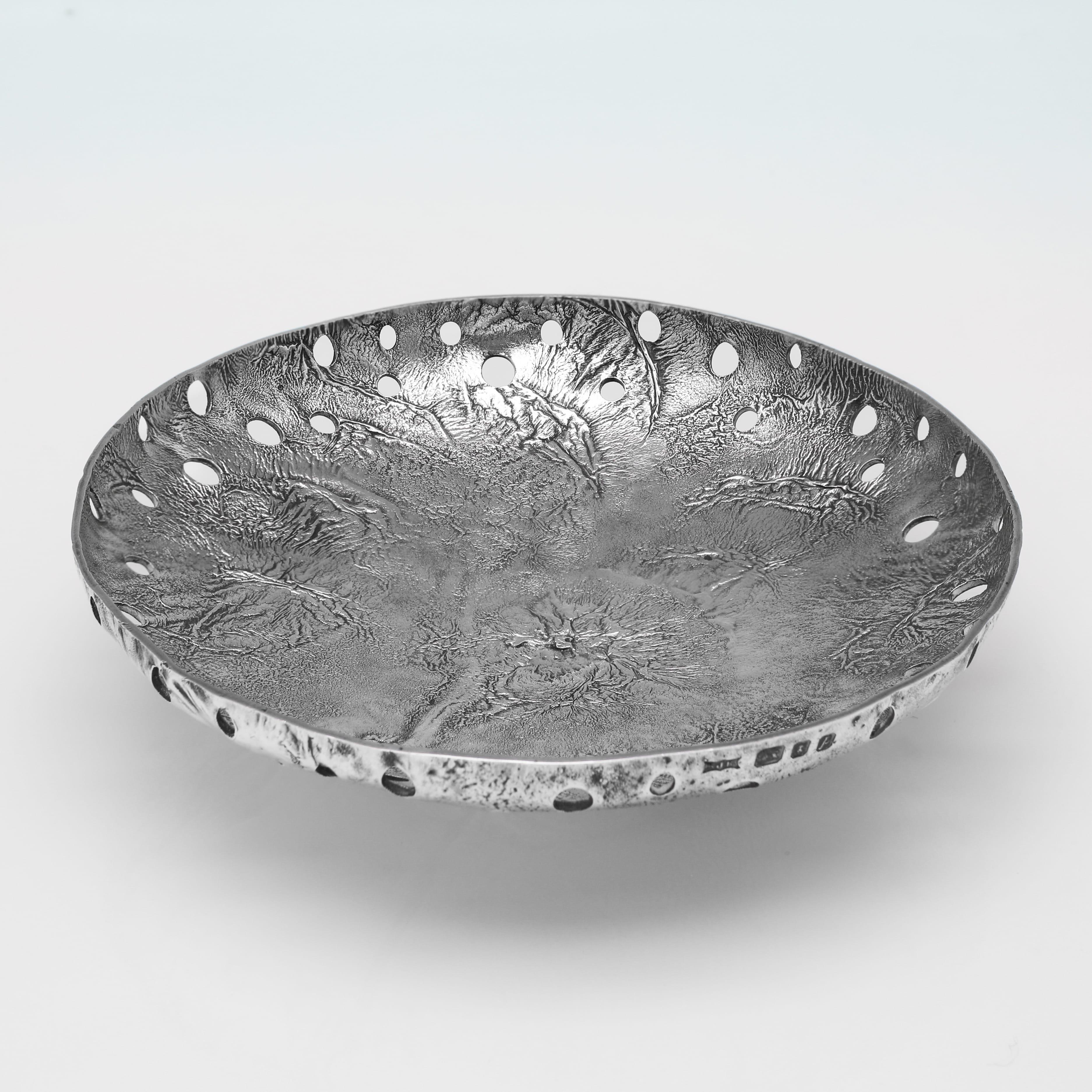 Hallmarked in London in 1970 by S. J. Rose, this attractive, Elizabeth II, Sterling Silver Dish, is finished using the samorodok technique resulting in a natural looking molten finish to the surface. This technique was widely used by famous