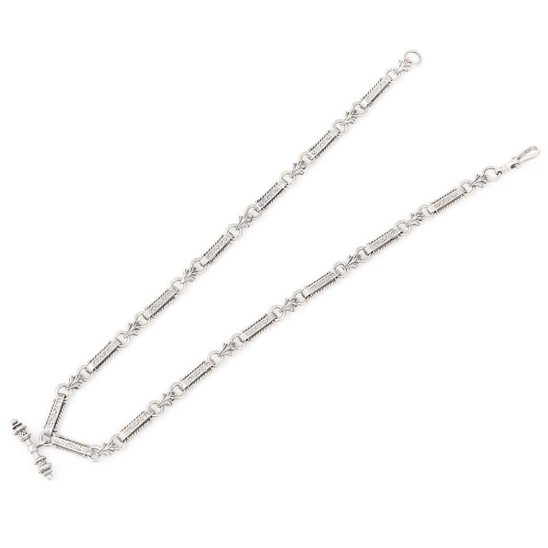 A beautiful fancy link Necklace formed of solid silver dating from the middle of the 20th century. The elongated links are highly decorated with cursive patterns to the top and bottom with further applied rope detailing to the edges. Connecting the